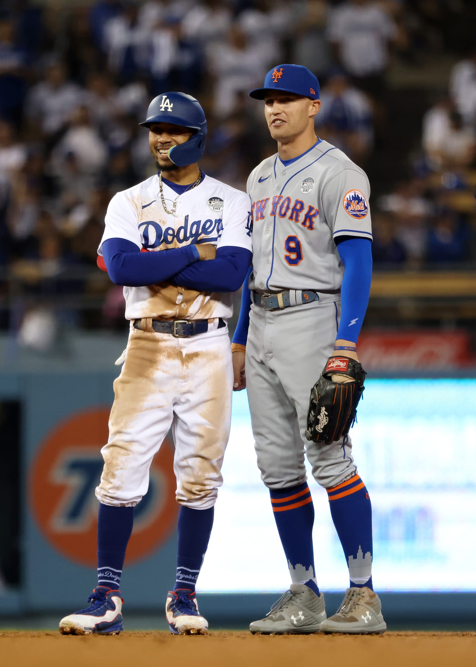 LOS ANGELES, CALIFORNIA - JUNE 02: Mookie Betts #50 of the Los Angeles Dodgers and Brandon Nimmo #9 of the New York Mets look on during a call review during the fifth inning at Dodger Stadium on June 02, 2022 in Los Angeles, California. (Photo by Katelyn Mulcahy/Getty Images)