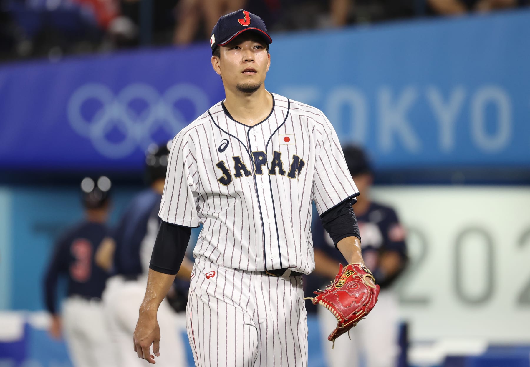 YOKOHAMA, JAPAN - AUGUST 07: Pitcher Kodai Senga #21 of Team Japan reacts after the sixth inning against Team United Staes during the gold medal game between Team United States and Team Japan on day fifteen of the Tokyo 2020 Olympic Games at Yokohama Baseball Stadium on August 07, 2021 in Yokohama, Kanagawa, Japan. (Photo by Koji Watanabe/Getty Images) YOKOHAMA, JAPAN - AUGUST 07: Pitcher Kodai Senga #21 of Team Japan reacts after the sixth inning against Team United Staes during the gold medal game between Team United States and Team Japan on day fifteen of the Tokyo 2020 Olympic Games at Yokohama Baseball Stadium on August 07, 2021 in Yokohama, Kanagawa, Japan. (Photo by Koji Watanabe/Getty Images)