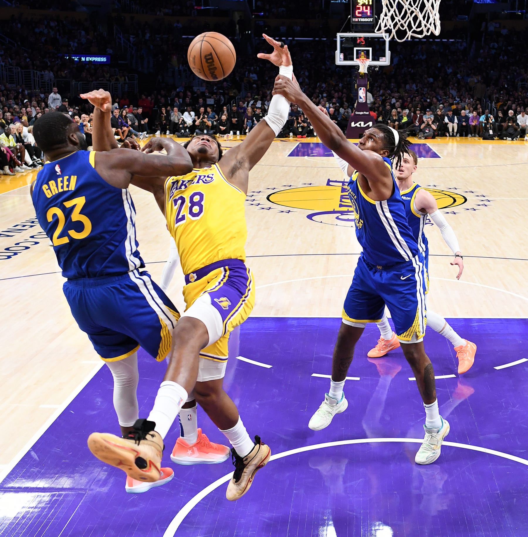 Los Angeles, California May 12, 2023-Lakers Rui Hachimura is taken down by Warriors Draymond Green in Game 6 of the NBA playoffs at Crypto.com Friday. (Wally Skalij/Los Angeles Times via Getty Images)
