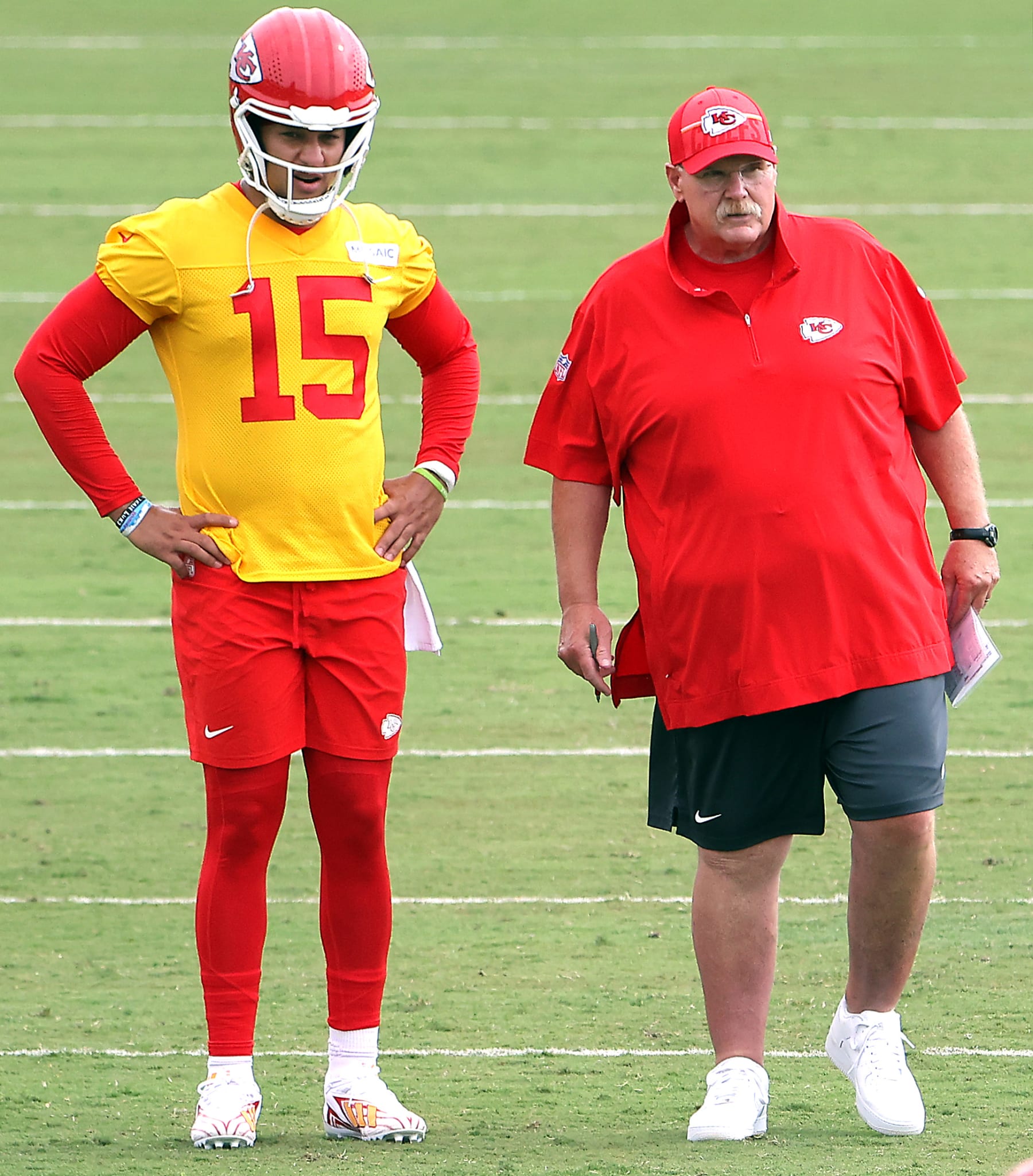ST JOSEPH, MISSOURI - JULY 25:  Quarterback Patrick Mahomes #15 of the Kansas City Chiefs stands with Head Coach Andy Reid during Kansas City Chiefs Training Camp on July 25, 2023 in St Joseph, Missouri. (Photo by Jamie Squire/Getty Images)