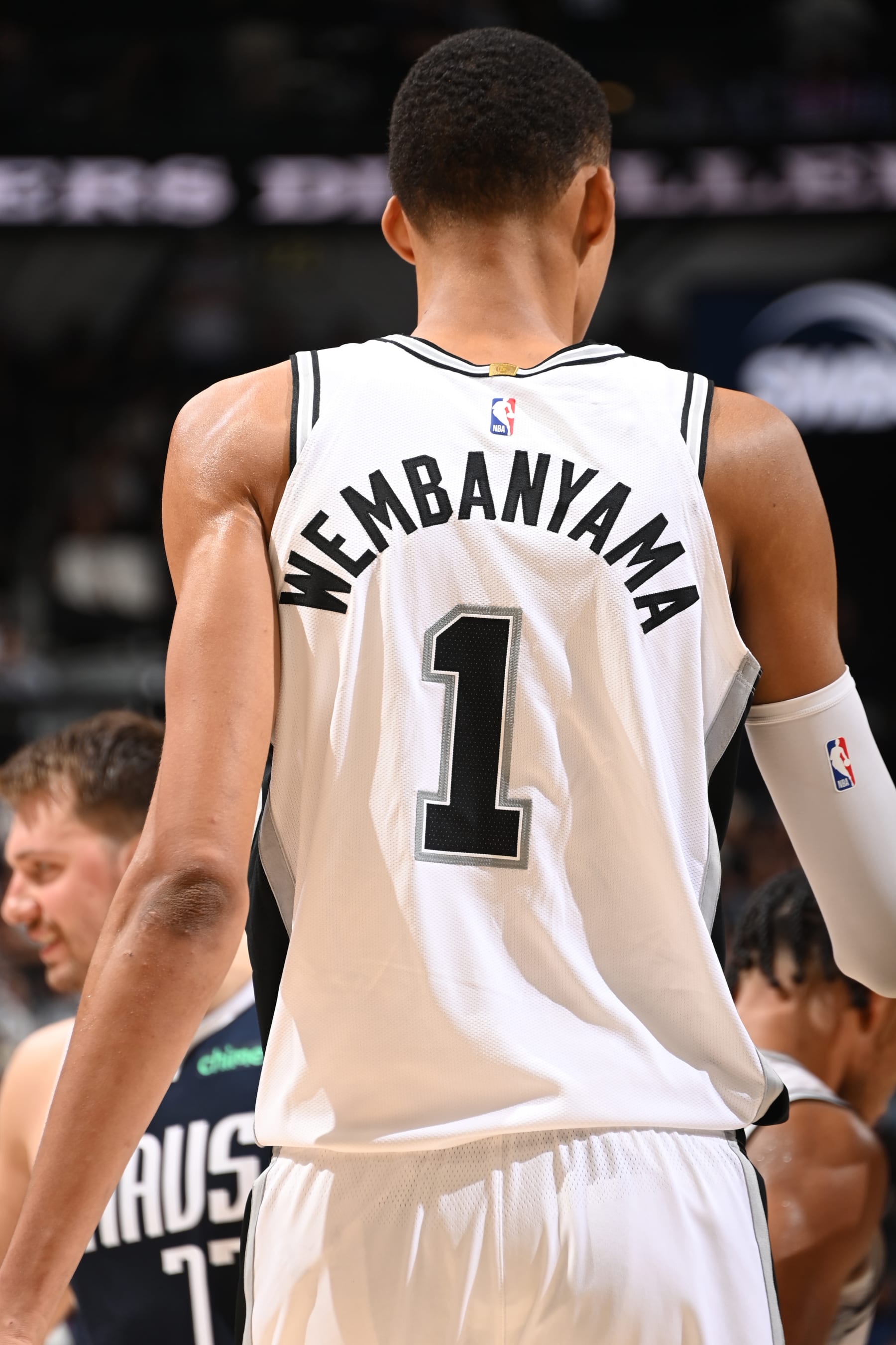SAN ANTONIO, TX - OCTOBER 25: Victor Wembanyama #1 of the San Antonio Spurs looks on during the game against the Dallas Mavericks on October 25, 2023 at the Frost Bank Center in San Antonio, Texas. NOTE TO USER: User expressly acknowledges and agrees that, by downloading and or using this photograph, user is consenting to the terms and conditions of the Getty Images License Agreement. Mandatory Copyright Notice: Copyright 2023 NBAE (Photos by Andrew D. Bernstein/NBAE via Getty Images)