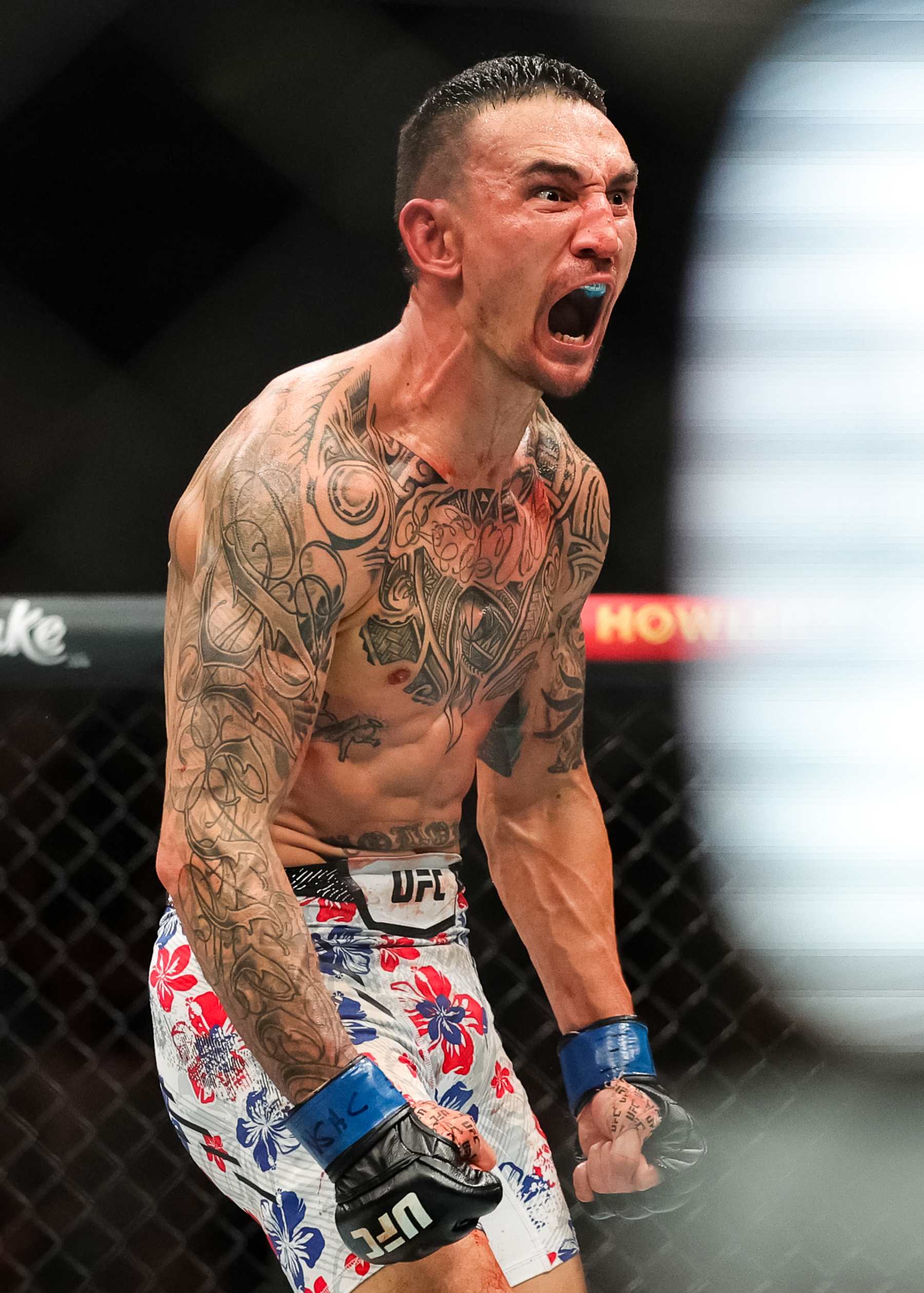 LAS VEGAS, NEVADA - APRIL 13: Max Holloway reacts to defating Justin Gaethje in their BMF title fight at T-Mobile Arena on April 13, 2024 in Las Vegas, Nevada. (Photo by Carmen Mandato/Getty Images)
