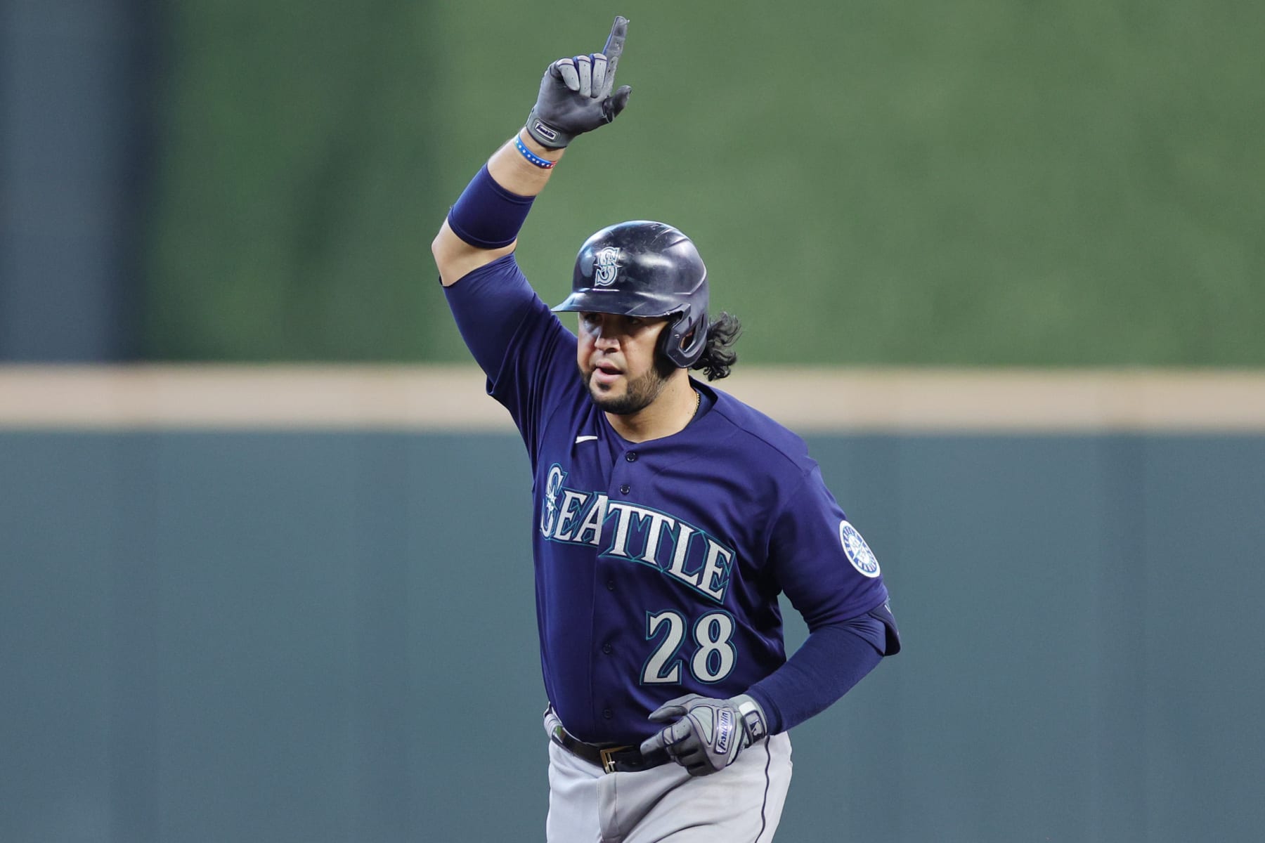 HOUSTON, TEXAS - OCTOBER 11: Eugenio Suarez #28 of the Seattle Mariners celebrates after his solo home run against the Houston Astros during the seventh inning in game one of the American League Division Series at Minute Maid Park on October 11, 2022 in Houston, Texas. (Photo by Carmen Mandato/Getty Images)