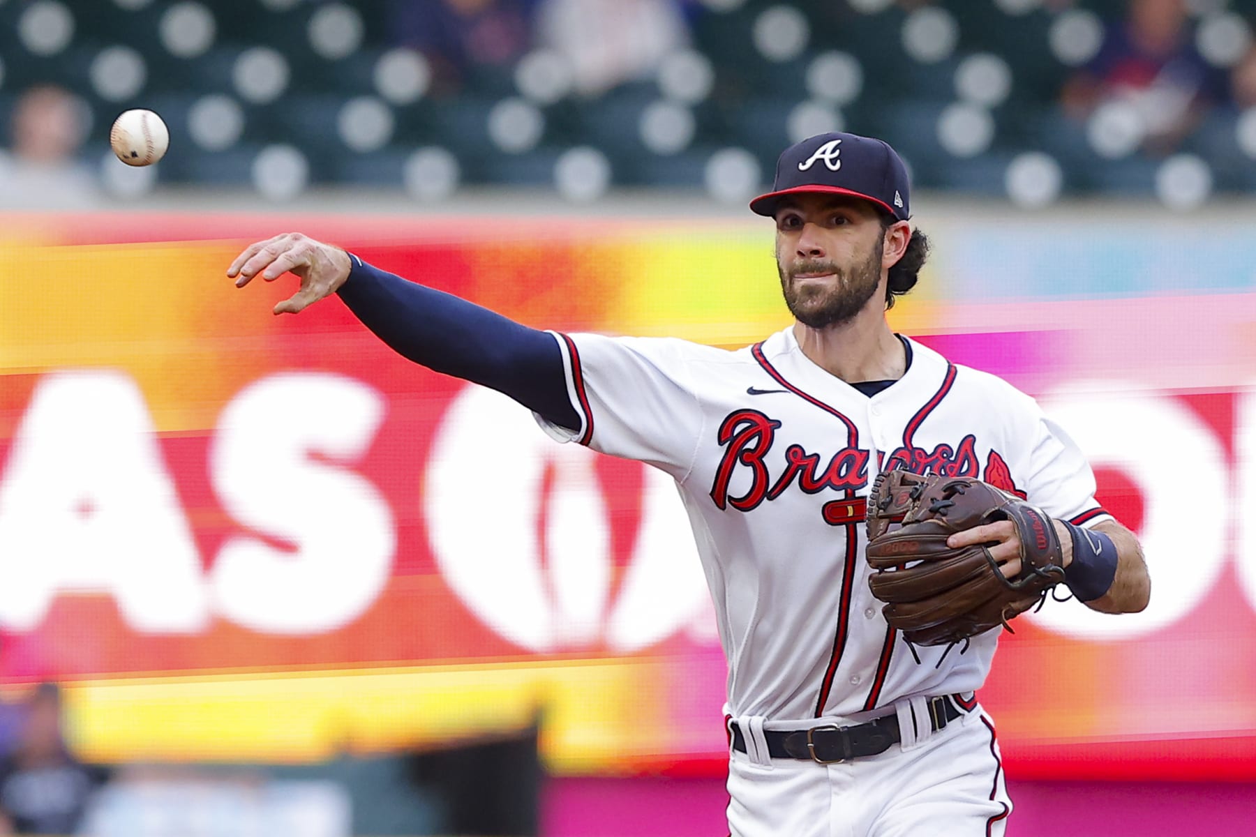 ATLANTA, GA - AUGUST 30: Dansby Swanson #7 of the Atlanta Braves fields and throws to first during the first inning against the Colorado Rockies at Truist Park on August 30, 2022 in Atlanta, Georgia. (Photo by Todd Kirkland/Getty Images)