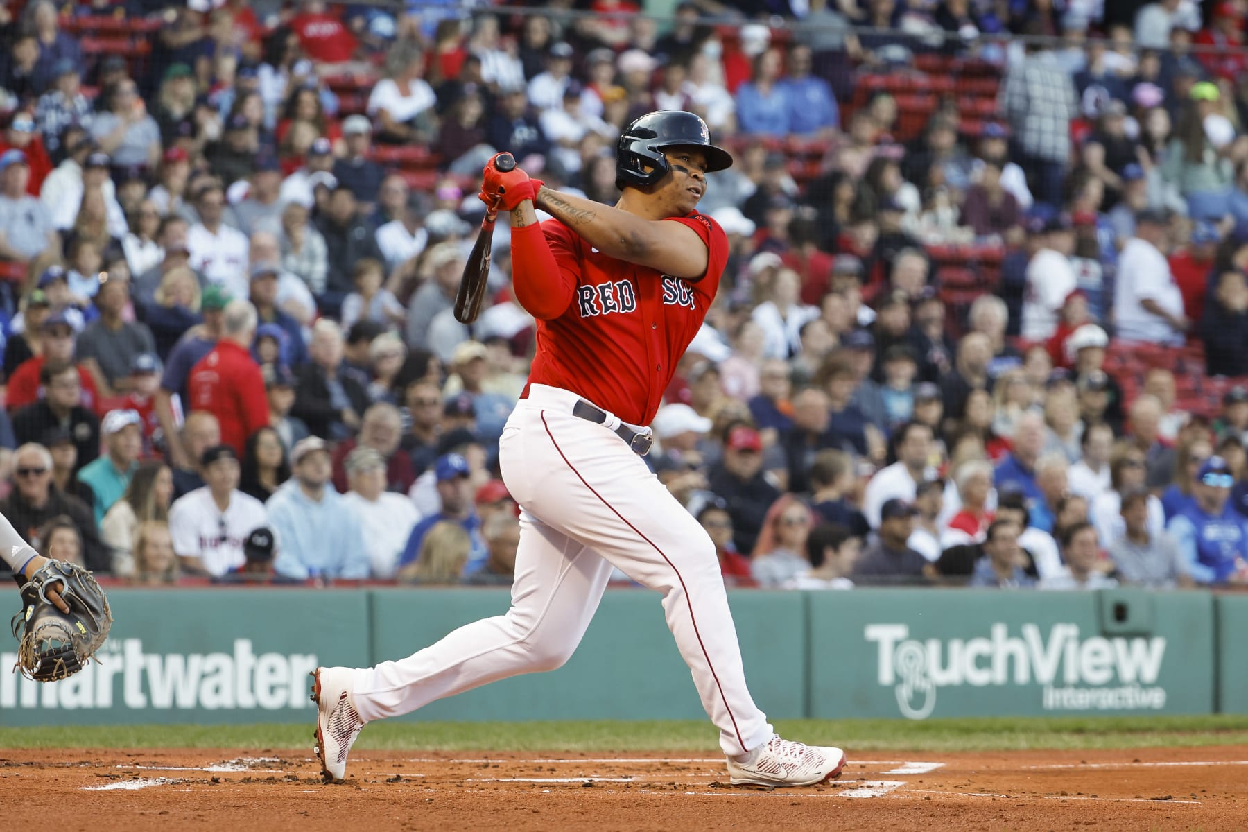 BOSTON, MA - SEPTEMBER 17: Rafael Devers #11 of the Boston Red Sox follows through on a hit against the Kansas City Royals during the first inning at Fenway Park on September 17, 2022 in Boston, Massachusetts. (Photo By Winslow Townson/Getty Images)