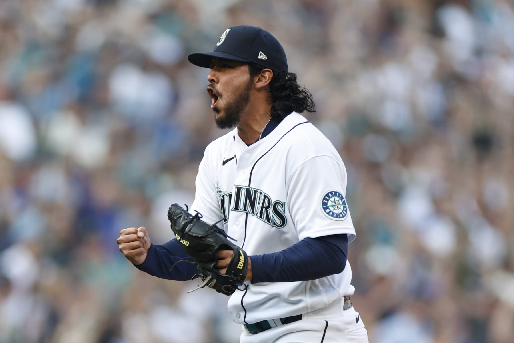SEATTLE, WASHINGTON - OCTOBER 15: Andres Munoz #75 of the Seattle Mariners reacts to getting out of the eighth inning against the Houston Astros in game three of the American League Division Series at T-Mobile Park on October 15, 2022 in Seattle, Washington. (Photo by Steph Chambers/Getty Images)