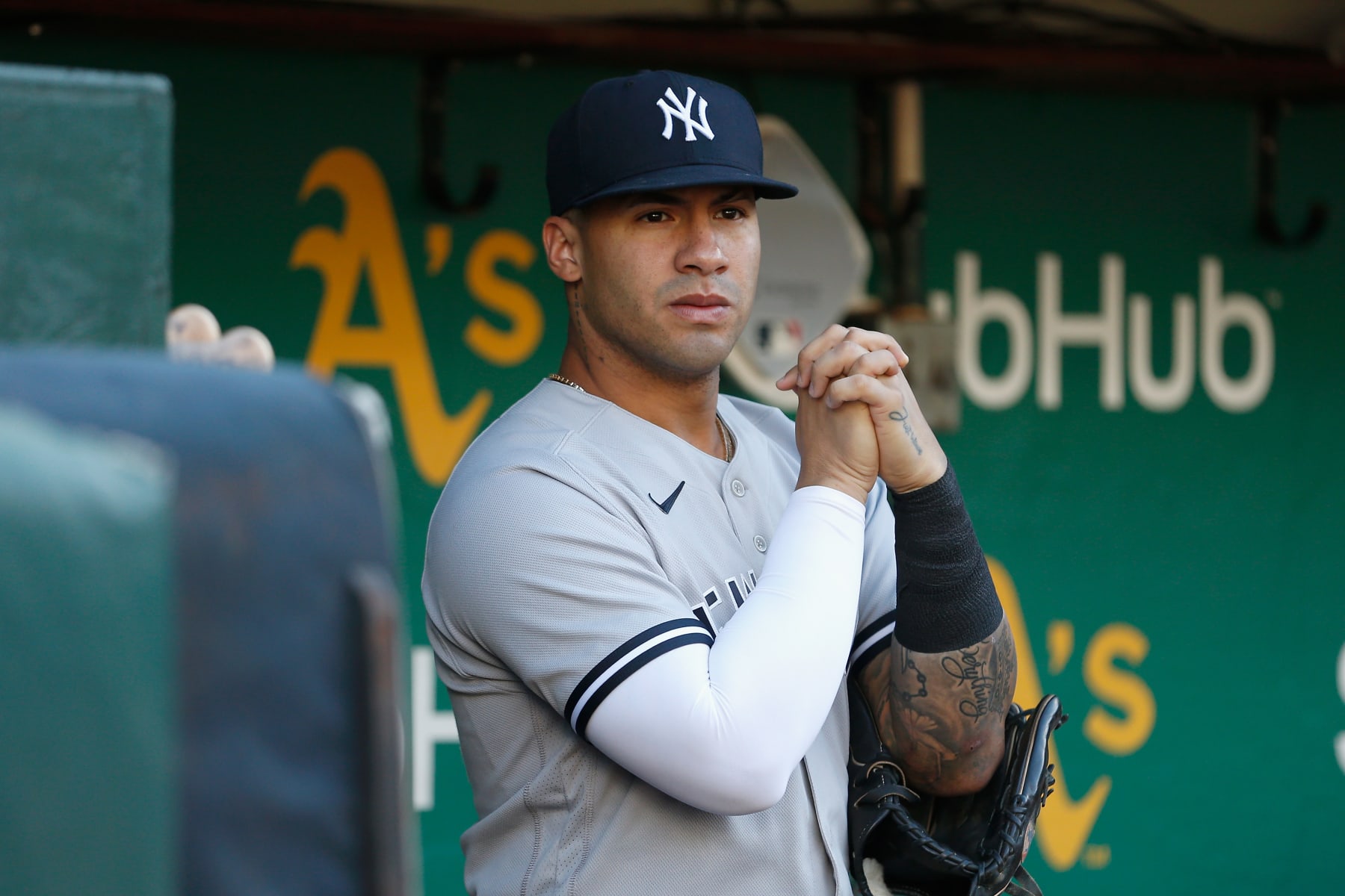 OAKLAND, CALIFORNIA - AUGUST 26: Gleyber Torres #25 of the New York Yankees prepares in the dugout before the game against the Oakland Athletics at RingCentral Coliseum on August 26, 2022 in Oakland, California. (Photo by Lachlan Cunningham/Getty Images)