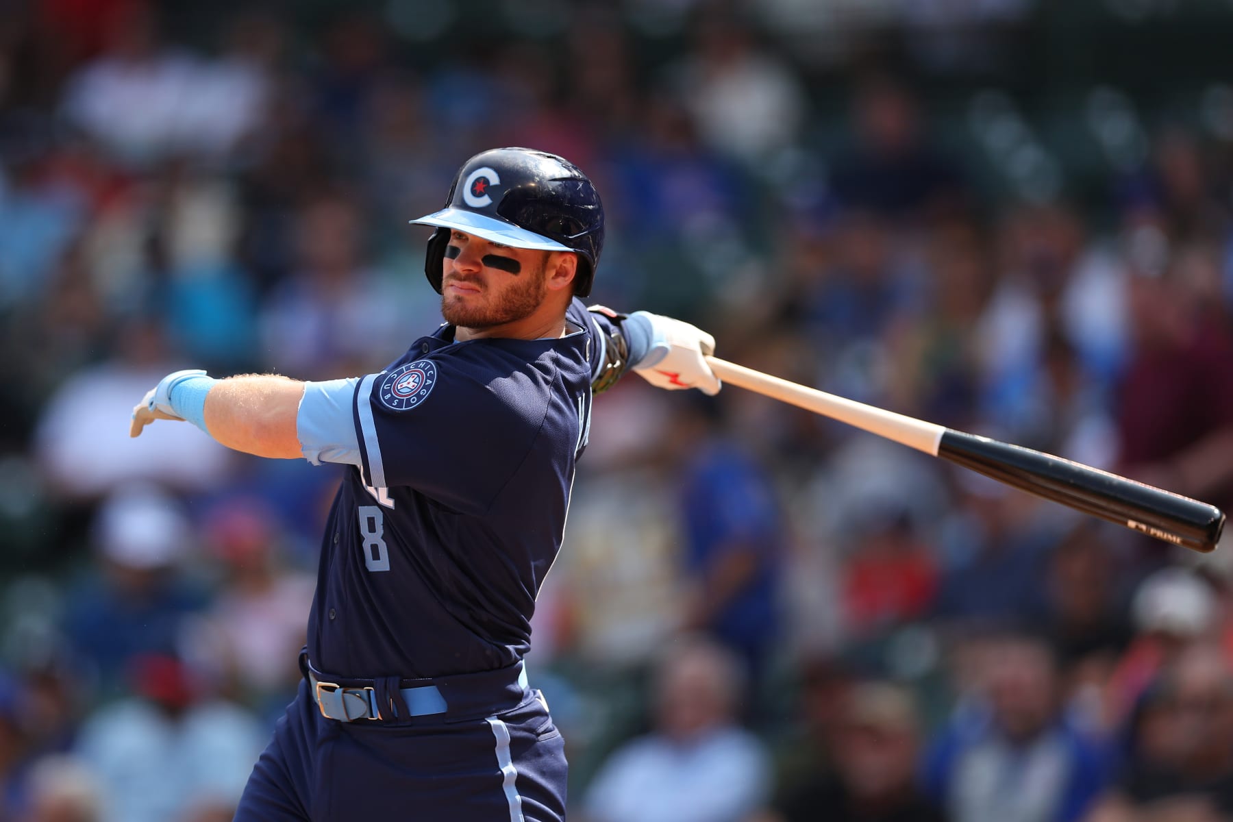CHICAGO, ILLINOIS - SEPTEMBER 16: Ian Happ #8 of the Chicago Cubs hits a RBI single during the first inning against the Colorado Rockies at Wrigley Field on September 16, 2022 in Chicago, Illinois. (Photo by Michael Reaves/Getty Images)
