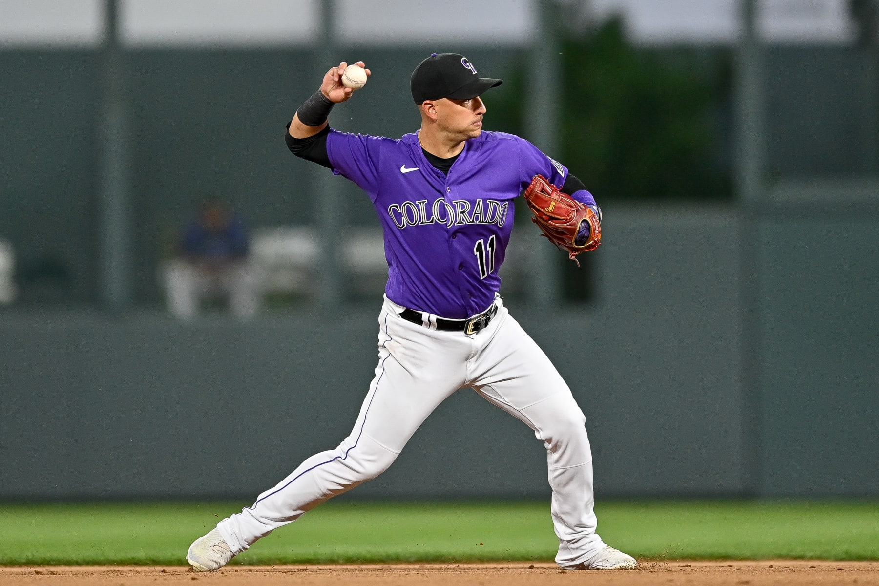 DENVER, CO - AUGUST 13: Jose Iglesias #11 of the Colorado Rockies throws to first base after fielding a ground ball in the eighth inning of a game against the Arizona Diamondbacks at Coors Field on August 13, 2022 in Denver, Colorado. (Photo by Dustin Bradford/Getty Images)