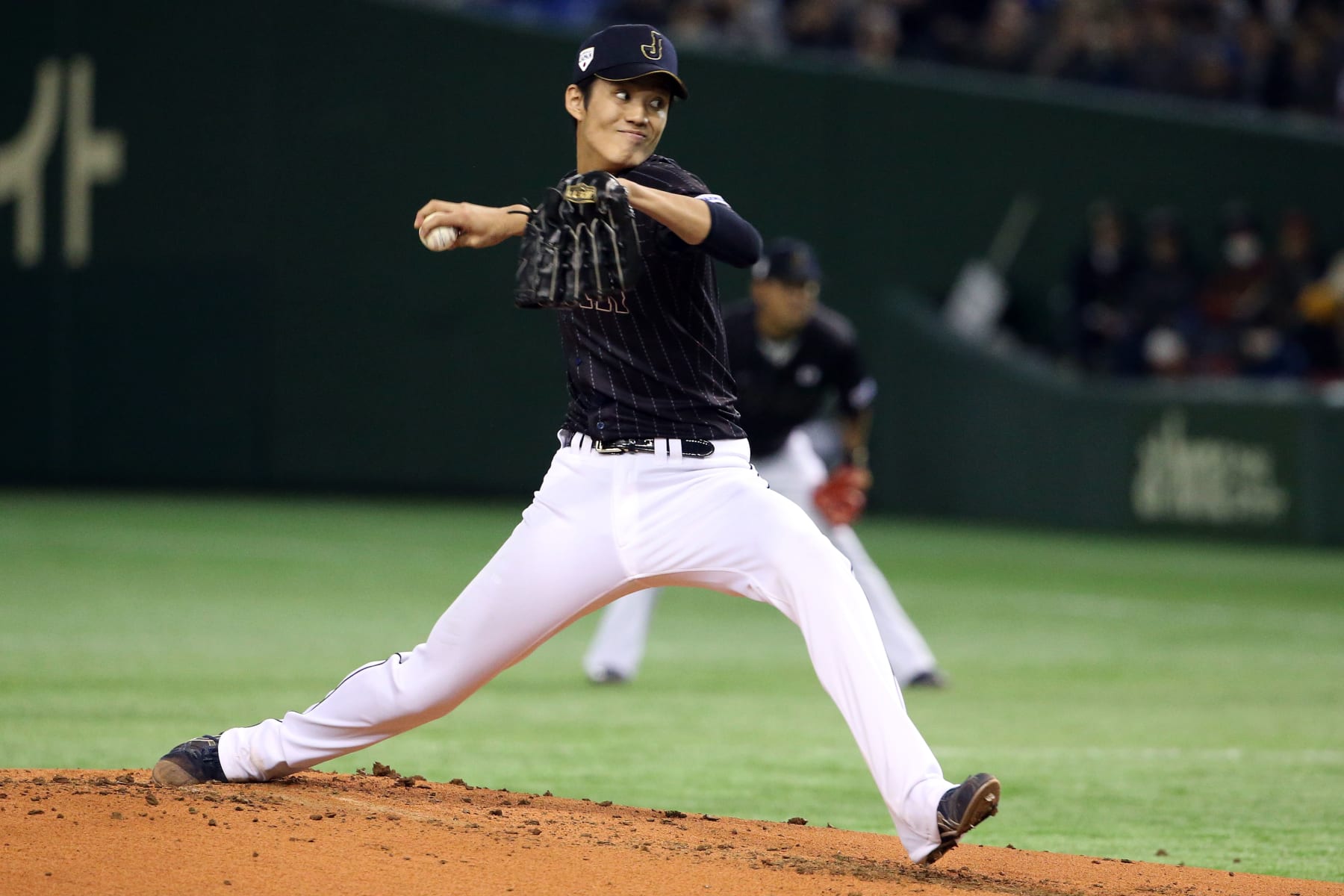 TOKYO, JAPAN - NOVEMBER 16:  Shintaro Fujinami #17 of Samurai Japan pitches in the first inning  during the game four of Samurai Japan and MLB All Stars at Tokyo Dome on November 16, 2014 in Tokyo, Japan.  (Photo by Atsushi Tomura/Getty Images)