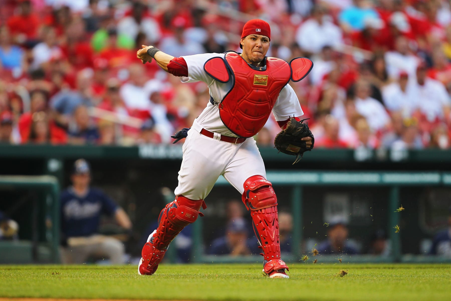 ST. LOUIS - SEPTEMBER 18: Yadier Molina #4 of the St. Louis Cardinals tries to throw out a runner against the San Diego Padres at Busch Stadium on September 18, 2010 in St. Louis, Missouri.  (Photo by Dilip Vishwanat/Getty Images)