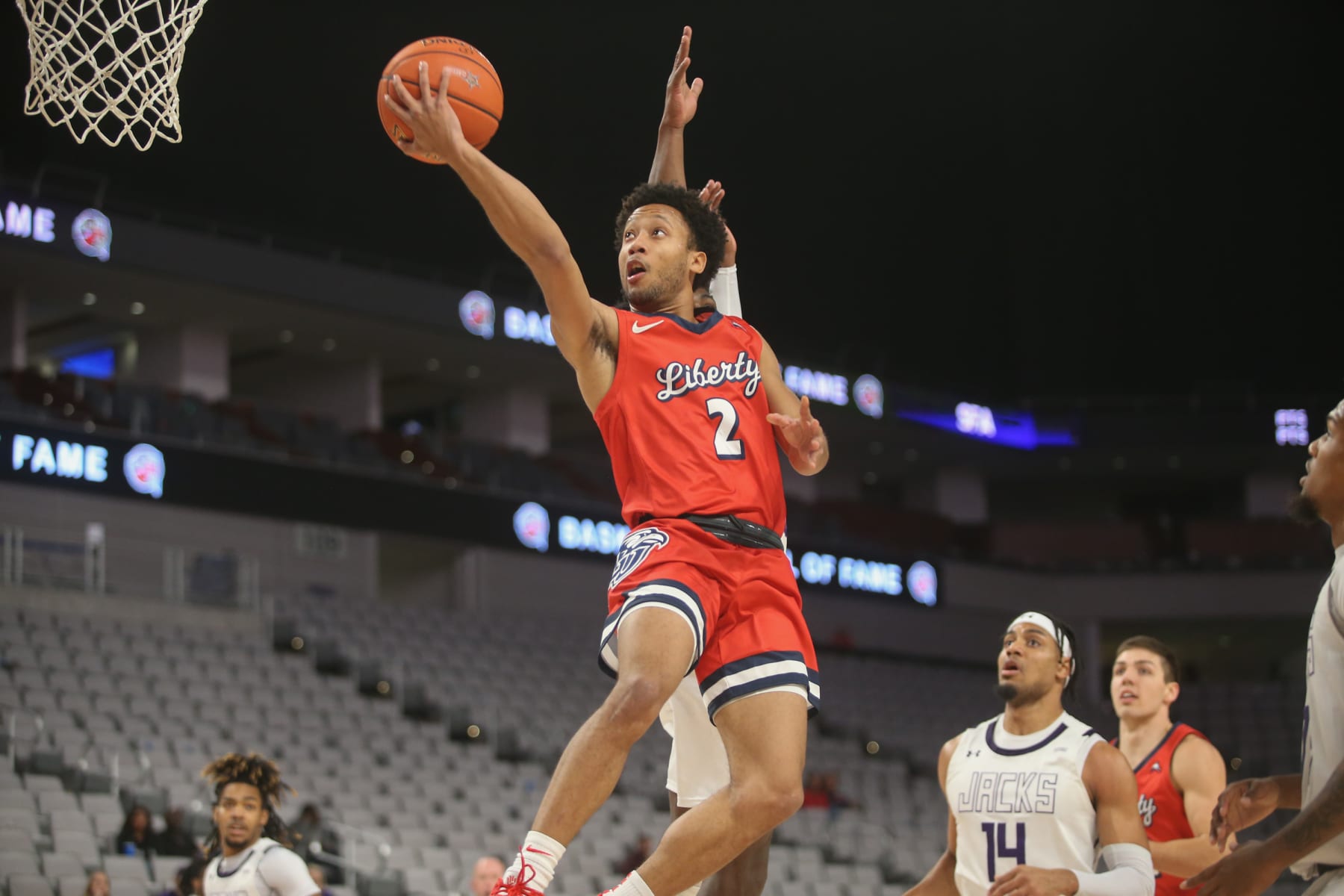 FORT WORTH, TX - DECEMBER 11: Liberty Flames guard Darius McGhee (2) goes to the basket during the Basketball Hall of Fame Classic game between Stephen F. Austin and Liberty on December 11,2021 at Dickies Arena in Fort Worth, TX.  (Photo by George Walker/Icon Sportswire via Getty Images)