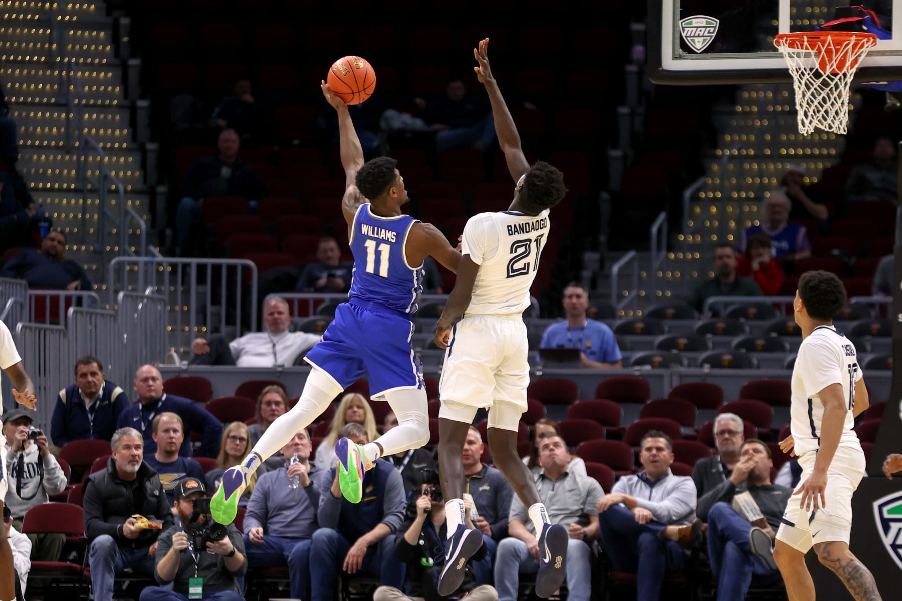 CLEVELAND, OH - MARCH 10: Buffalo Bulls forward Jeenathan Williams (11) shoots as Akron Zips center Aziz Bandaogo (21) defendsduring the first half of the MAC Mens Basketball Tournament Quarterfinal game between the Akron Zips and Buffalo Bulls on March 10, 2022, at Quicken Loans Arena in Cleveland, OH. (Photo by Frank Jansky/Icon Sportswire via Getty Images)