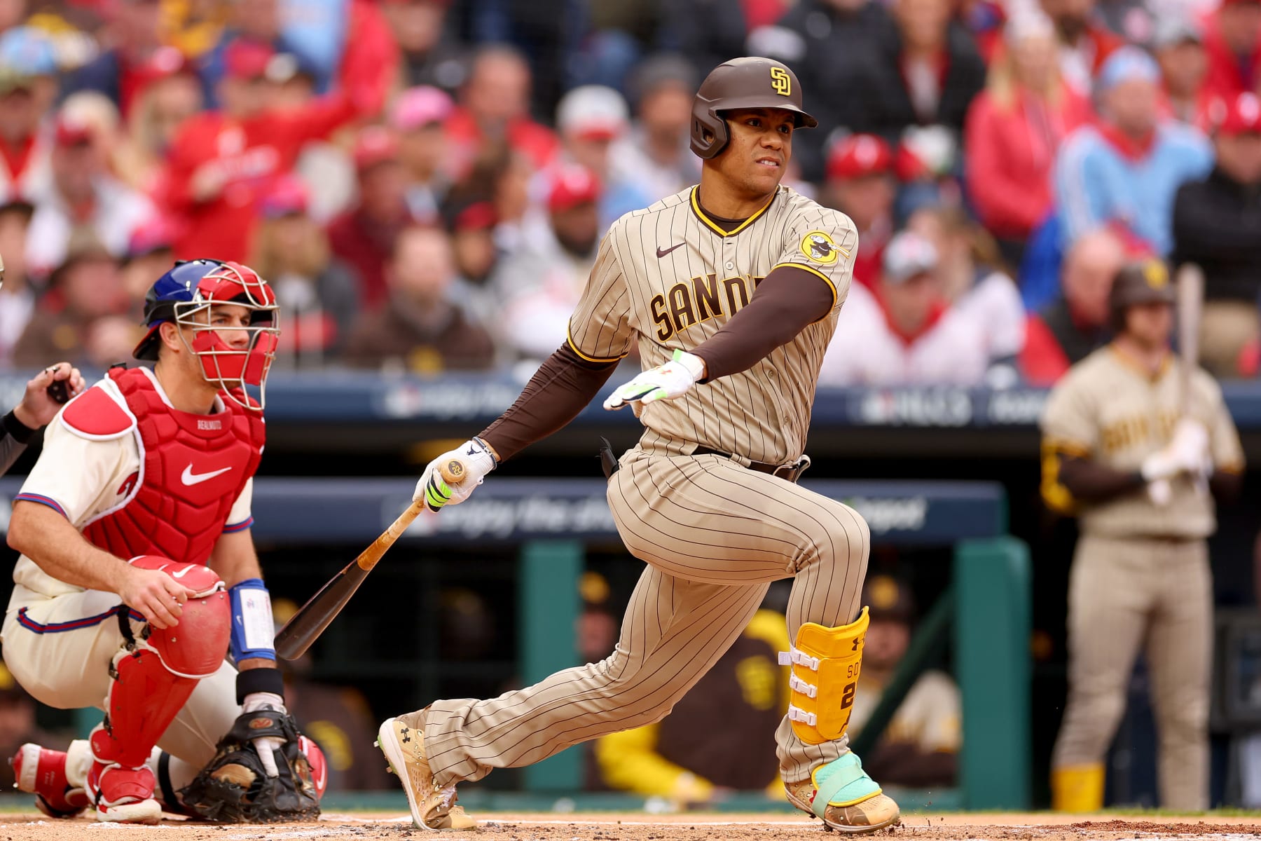 PHILADELPHIA, PENNSYLVANIA - OCTOBER 23: Juan Soto #22 of the San Diego Padres swings at a pitch during the first inning against the Philadelphia Phillies in game five of the National League Championship Series at Citizens Bank Park on October 23, 2022 in Philadelphia, Pennsylvania. (Photo by Mike Ehrmann/Getty Images)