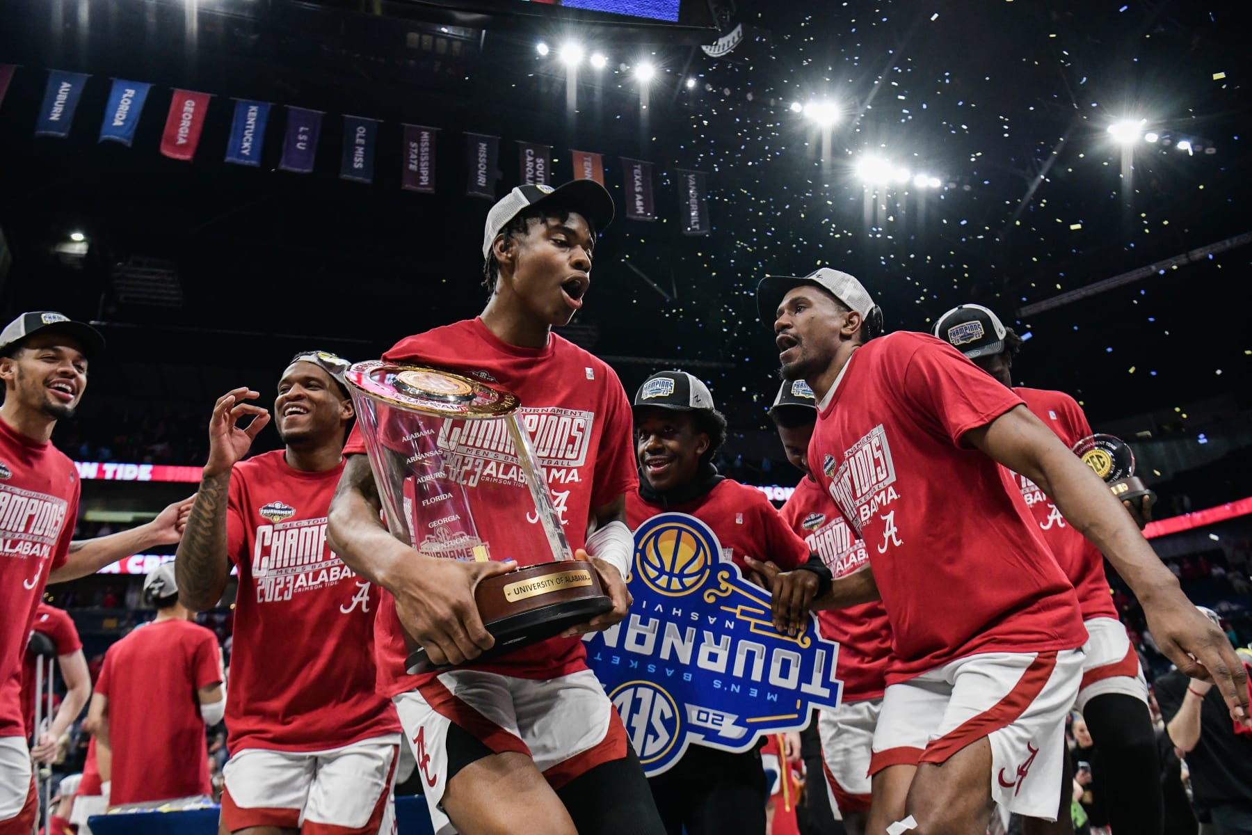 NASHVILLE, TENNESSEE - MARCH 12: Nick Pringle #23, Noah Gurley #4, and Rylan Griffen #3 of the Alabama Crimson Tide celebrate the win against the Texas A&M Aggies during the 2023 SEC Men's Basketball Tournament Championship game at Bridgestone Arena on March 12, 2023 in Nashville, Tennessee. (Photo by Carly Mackler/Getty Images)