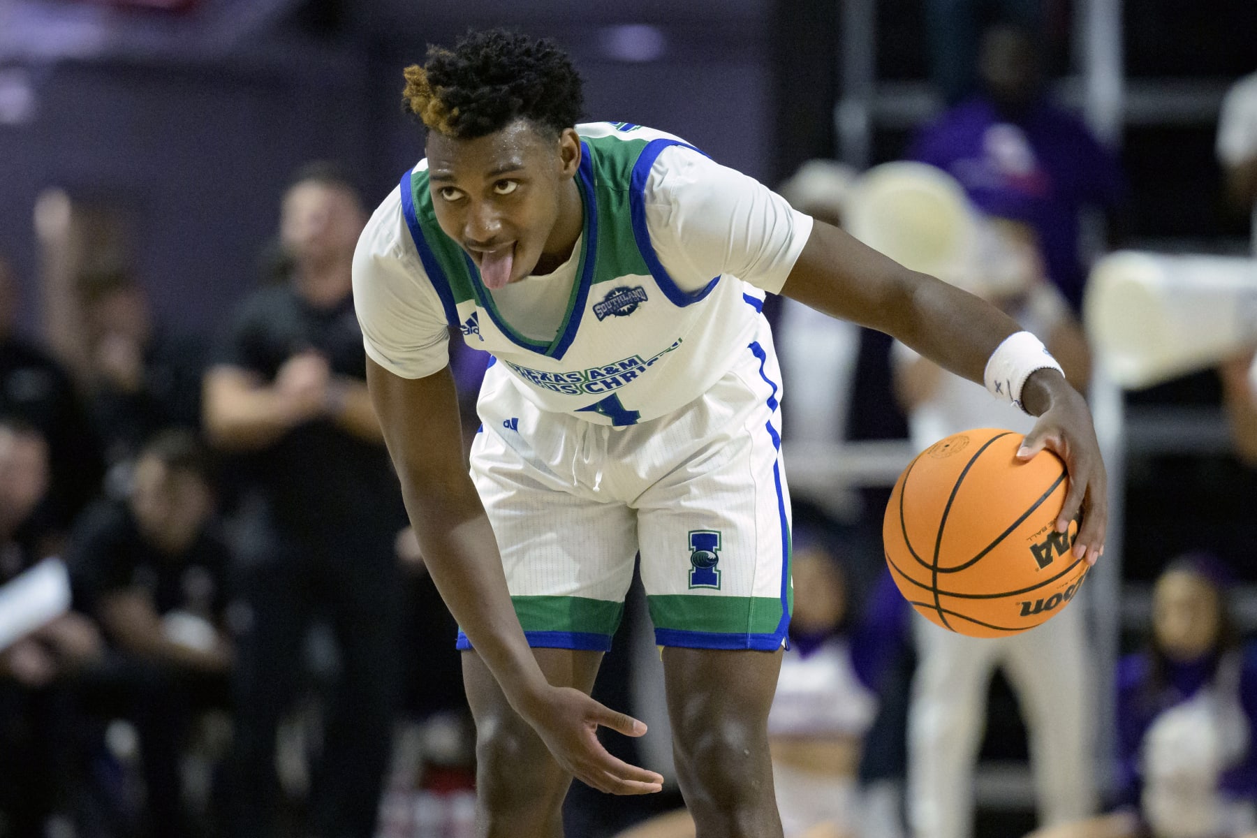 Texas A&M Corpus Christi guard Jalen Jackson (4) dribbles during the second half an NCAA college basketball game against Northwestern State in the finals of the Southland Conference men's tournament in Lake Charles, La., Wednesday, March 8, 2023. (AP Photo/Matthew Hinton)
