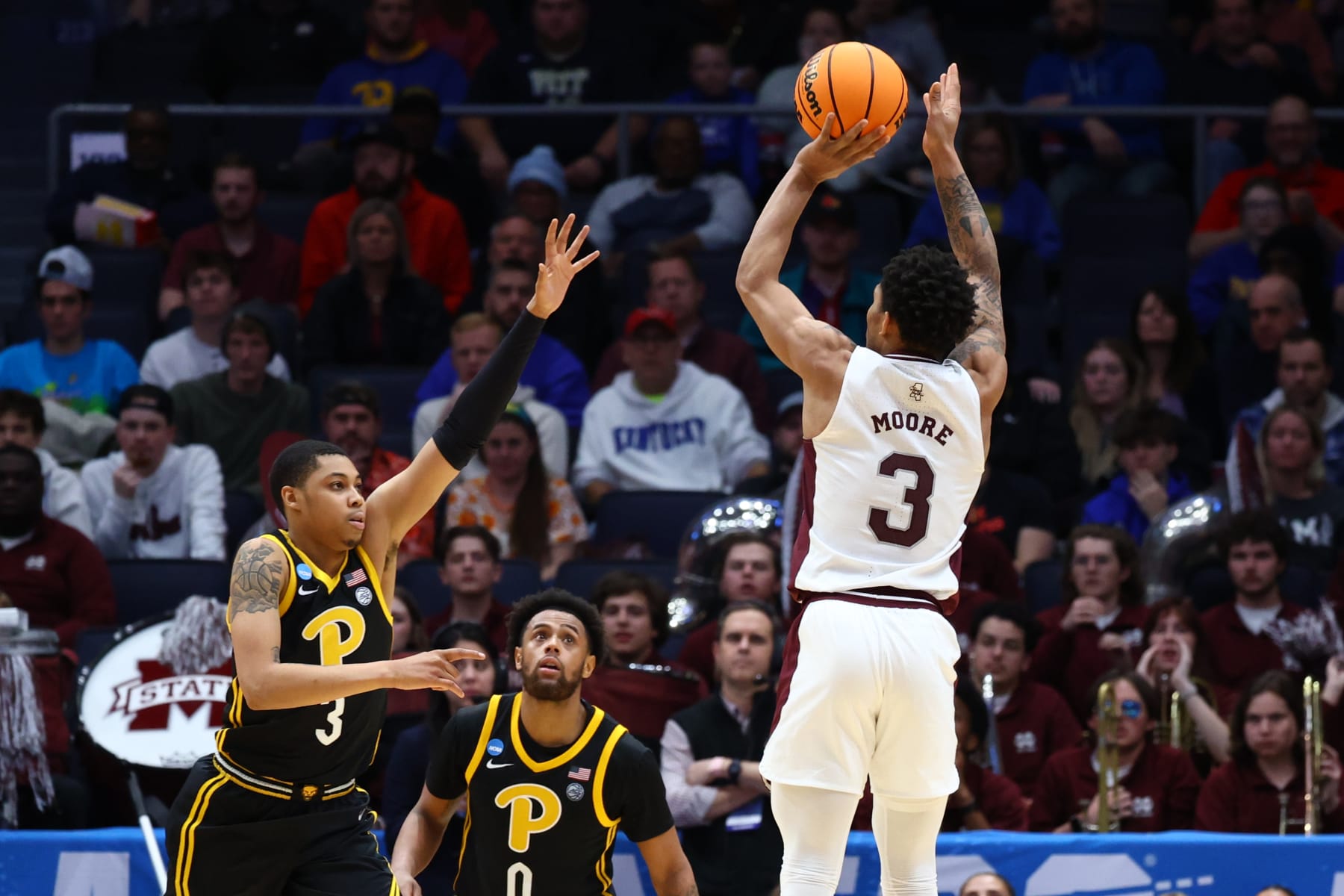DAYTON, OH - MARCH 14: Shakeel Moore #3 of the Mississippi State Bulldogs shoots over Greg Elliott #3 of the Pittsburgh Panthers during the First Four round of the 2023 NCAA Men's Basketball Tournament held at UD Arena on March 14, 2023 in Dayton, Ohio. (Photo by Tyler Schank/NCAA Photos via Getty Images)