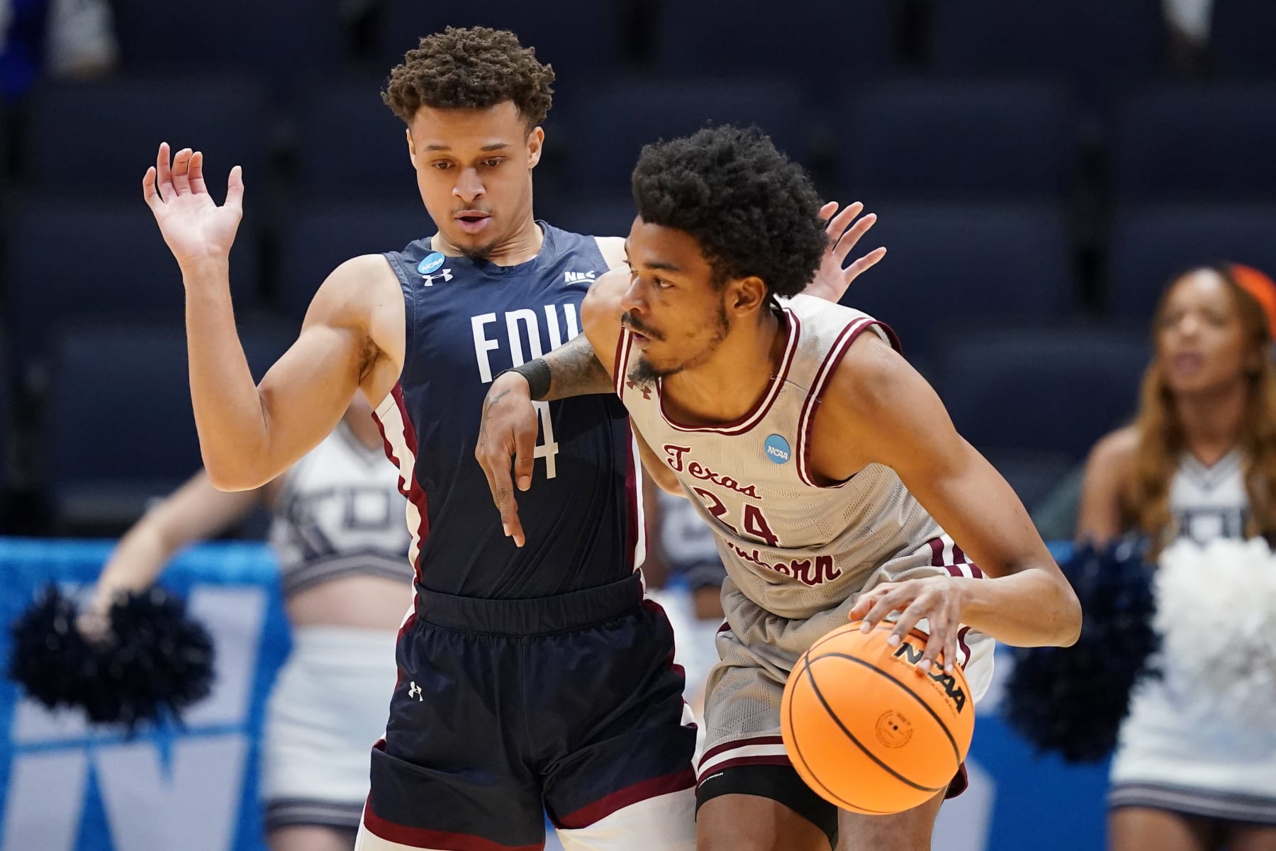 DAYTON, OHIO - MARCH 15: Grant Singleton #4 of the Fairleigh Dickinson Knights defends John Walker III #24 of the Texas Southern Tigers during the first half in the First Four game of the NCAA Men's Basketball Tournament at University of Dayton Arena on March 15, 2023 in Dayton, Ohio. (Photo by Dylan Buell/Getty Images)