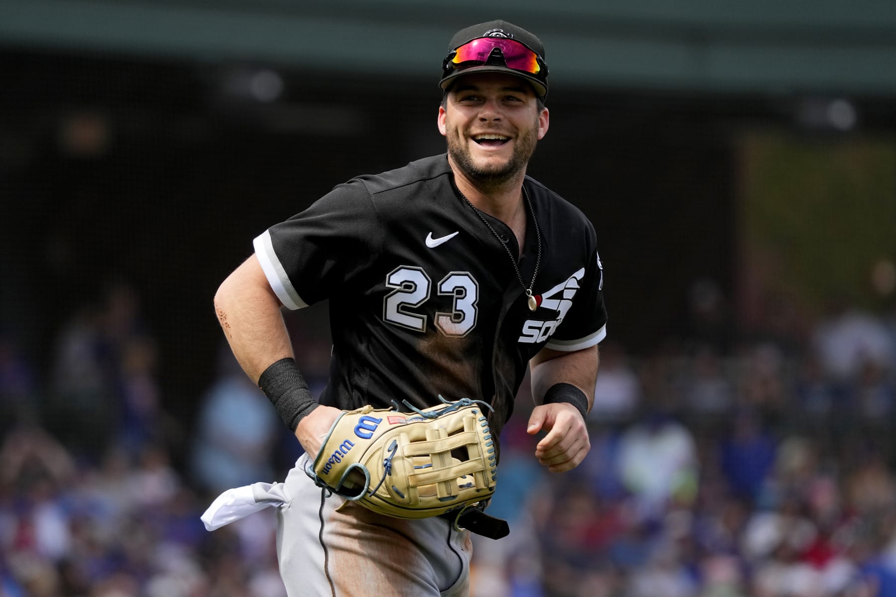 Chicago White Sox Andrew Benintendi smiles towards his bench after being called out at the plate during the first inning of a spring training baseball game against the Chicago Cubs, Friday, March 10, 2023, in Mesa, Ariz. (AP Photo/Matt York)