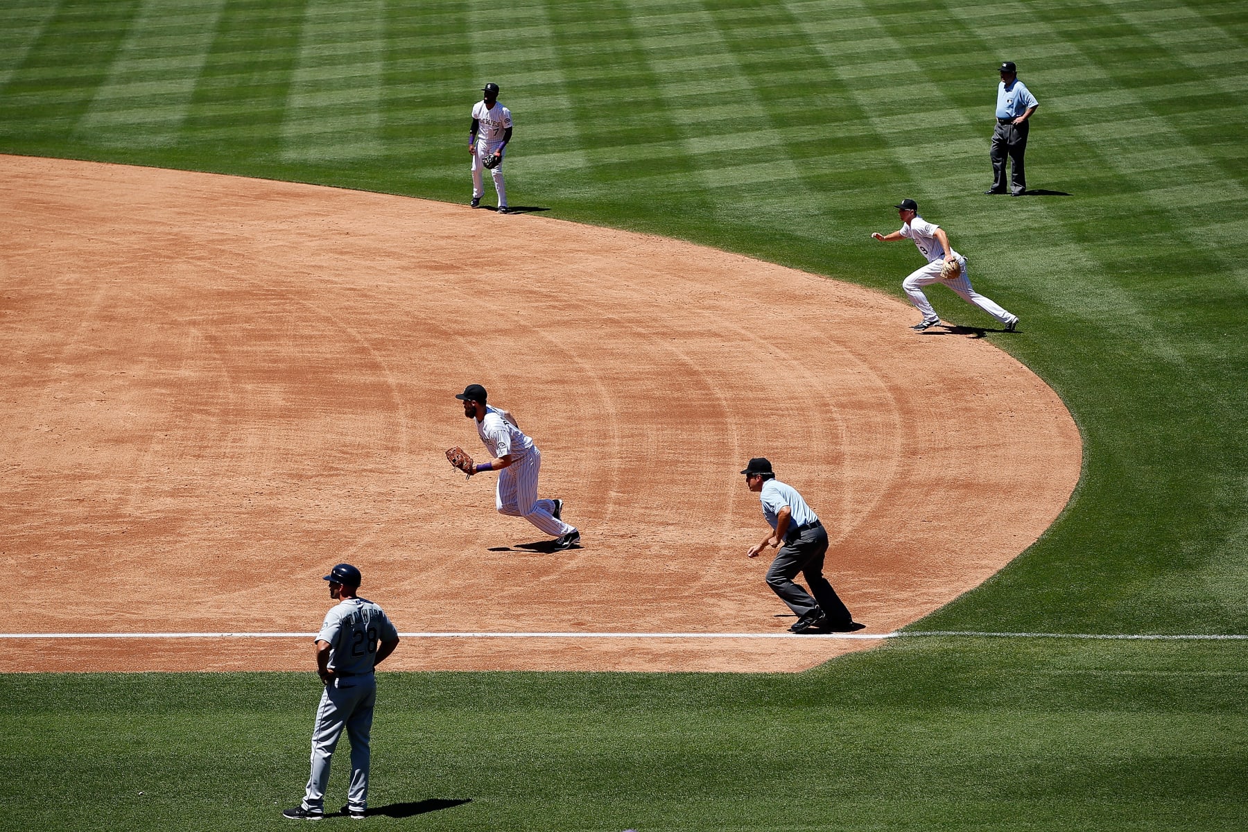 DENVER, CO - AUGUST 05:  The Colorado Rockies infield employ the infield shift as they defend against the Seattle Mariners  during interleague play at Coors Field on August 5, 2015 in Denver, Colorado. The Rockies defeated the Mariners 7-5 in 11 innings.  (Photo by Doug Pensinger/Getty Images)
