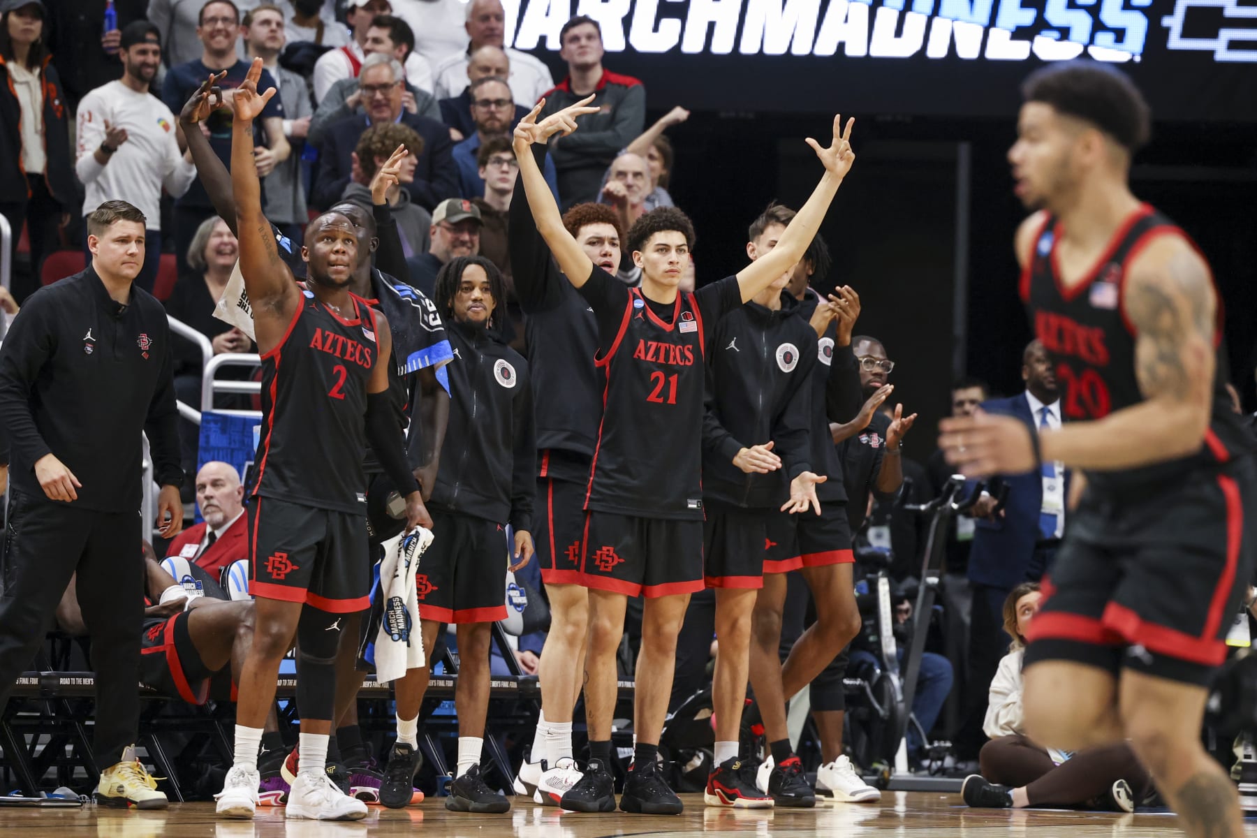LOUISVILLE, KY - MARCH 24: The San Diego State Aztecs bench celebrates scoring against the Alabama Crimson Tide during the Sweet Sixteen round of the 2022 NCAA Men's Basketball Tournament held at KFC YUM! Center on March 24, 2023 in Louisville, Kentucky. (Photo by Joe Robbins/NCAA Photos via Getty Images)