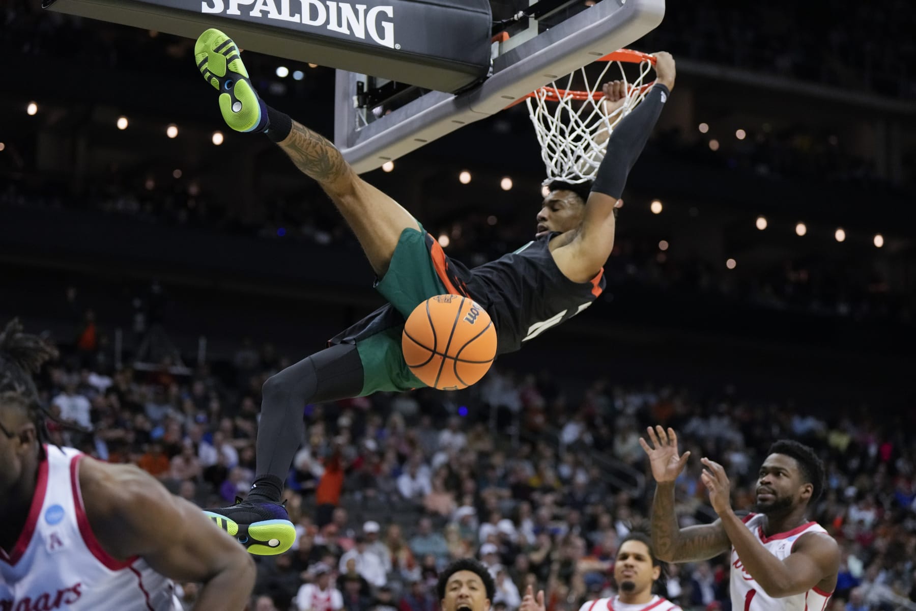 Miami guard Jordan Miller dunks against Houston in the first half of a Sweet 16 college basketball game in the Midwest Regional of the NCAA Tournament Friday, March 24, 2023, in Kansas City, Mo. (AP Photo/Jeff Roberson)