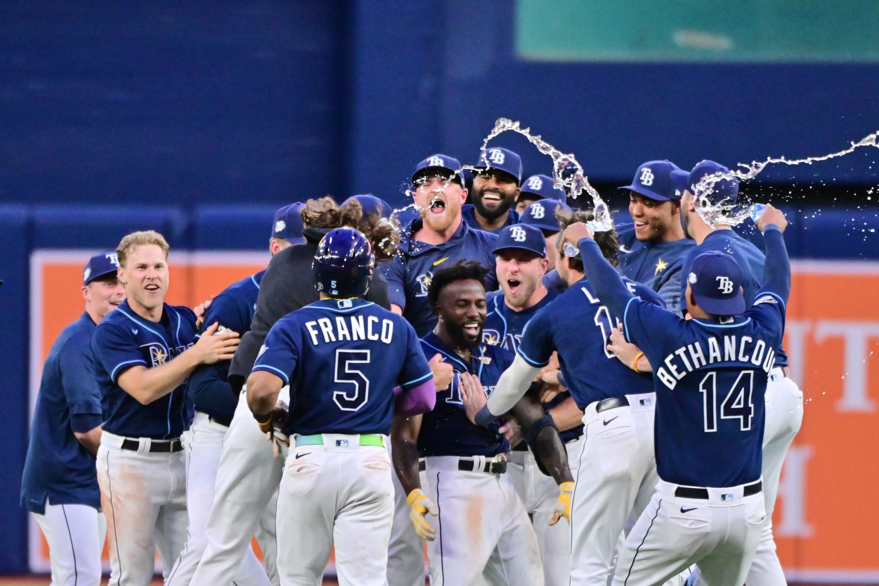 ST PETERSBURG, FLORIDA - APRIL 22: Randy Arozarena #56 of the Tampa Bay Rays celebrates with teammates after hitting an RBI walk-off single to defeat the Chicago White Sox 4-3 at Tropicana Field on April 22, 2023 in St Petersburg, Florida. (Photo by Julio Aguilar/Getty Images)