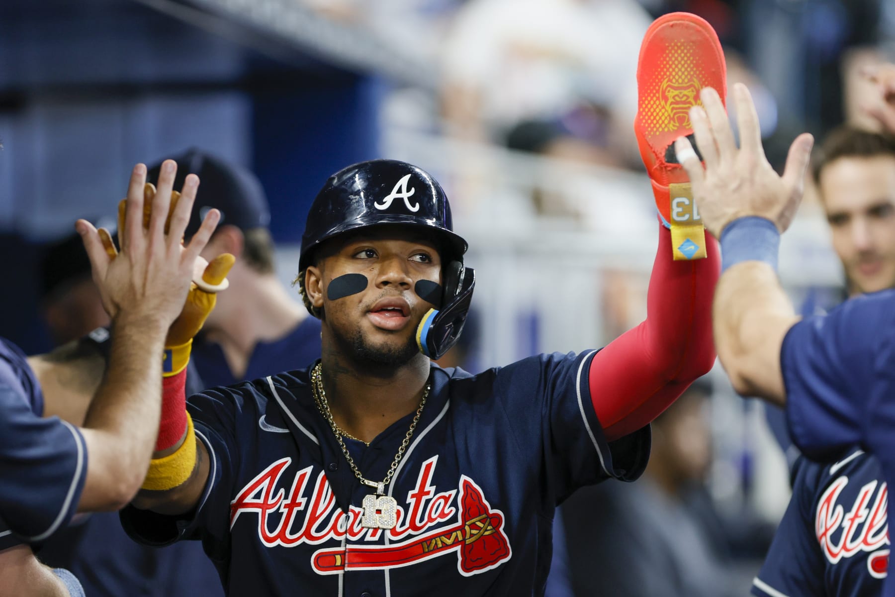 MIAMI, FLORIDA - MAY 04: Ronald Acuna Jr. #13 of the Atlanta Braves celebrates with teammates after scoring against the Miami Marlins during the first inning at loanDepot park on May 04, 2023 in Miami, Florida. (Photo by Sam Navarro/Getty Images)