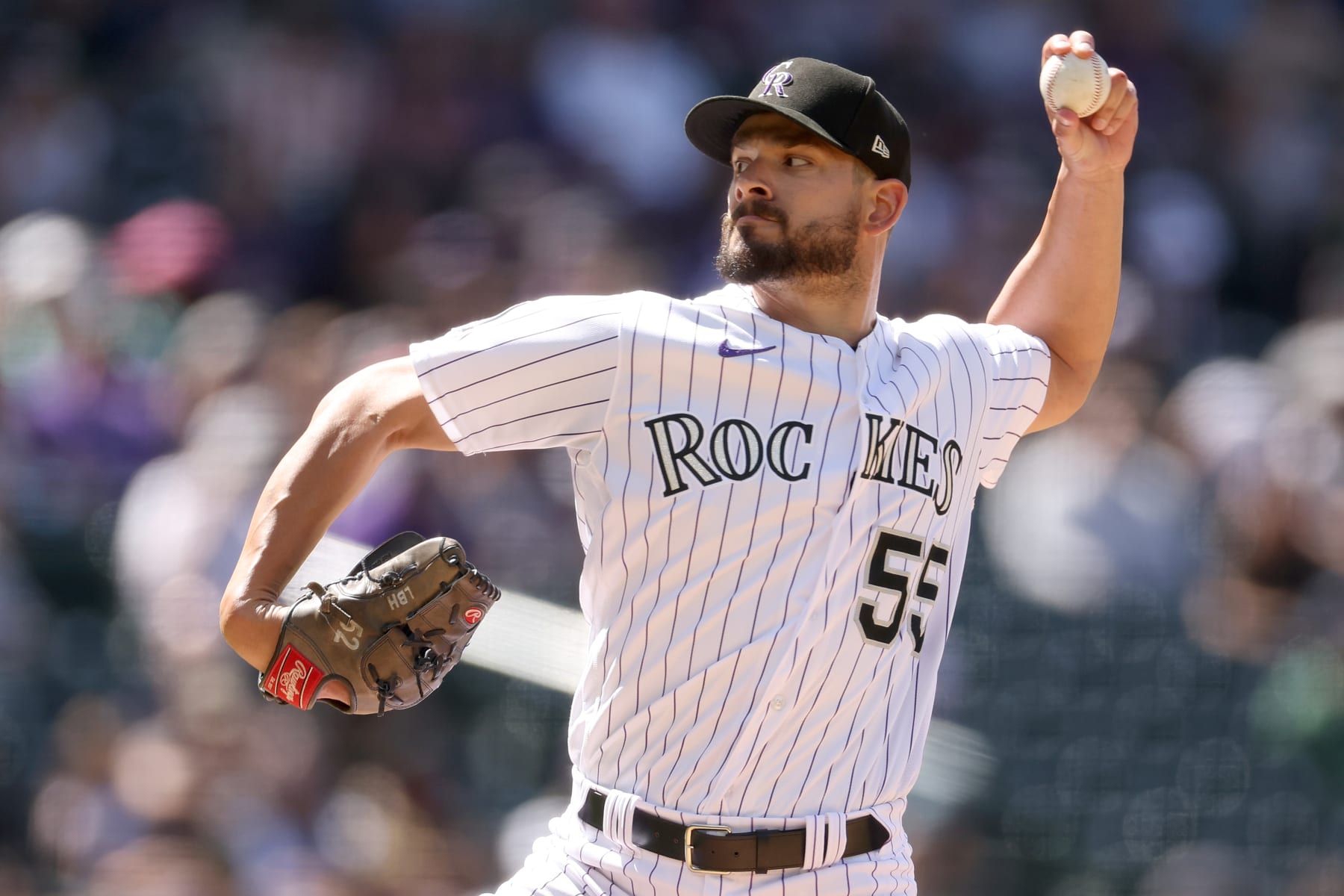 DENVER, COLORADO - MAY 04: Pitcher Brad Hand #55 of the Colorado Rockies throws against the Milwaukee Brewers in the eighth inning at Coors Field on May 04, 2023 in Denver, Colorado. (Photo by Matthew Stockman/Getty Images)