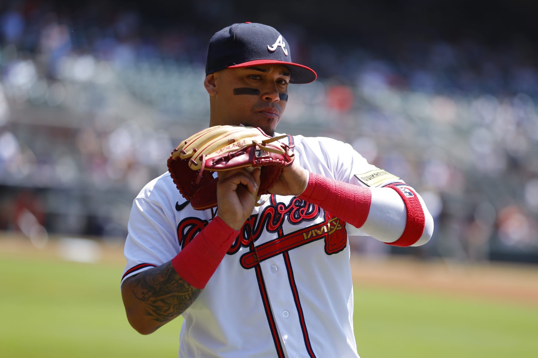 ATLANTA, GA - JUNE 28: Orlando Arcia #11 of the Atlanta Braves warms up prior to the game against the Minnesota Twins at Truist Park on June 28, 2023 in Atlanta, Georgia. (Photo by Todd Kirkland/Getty Images)