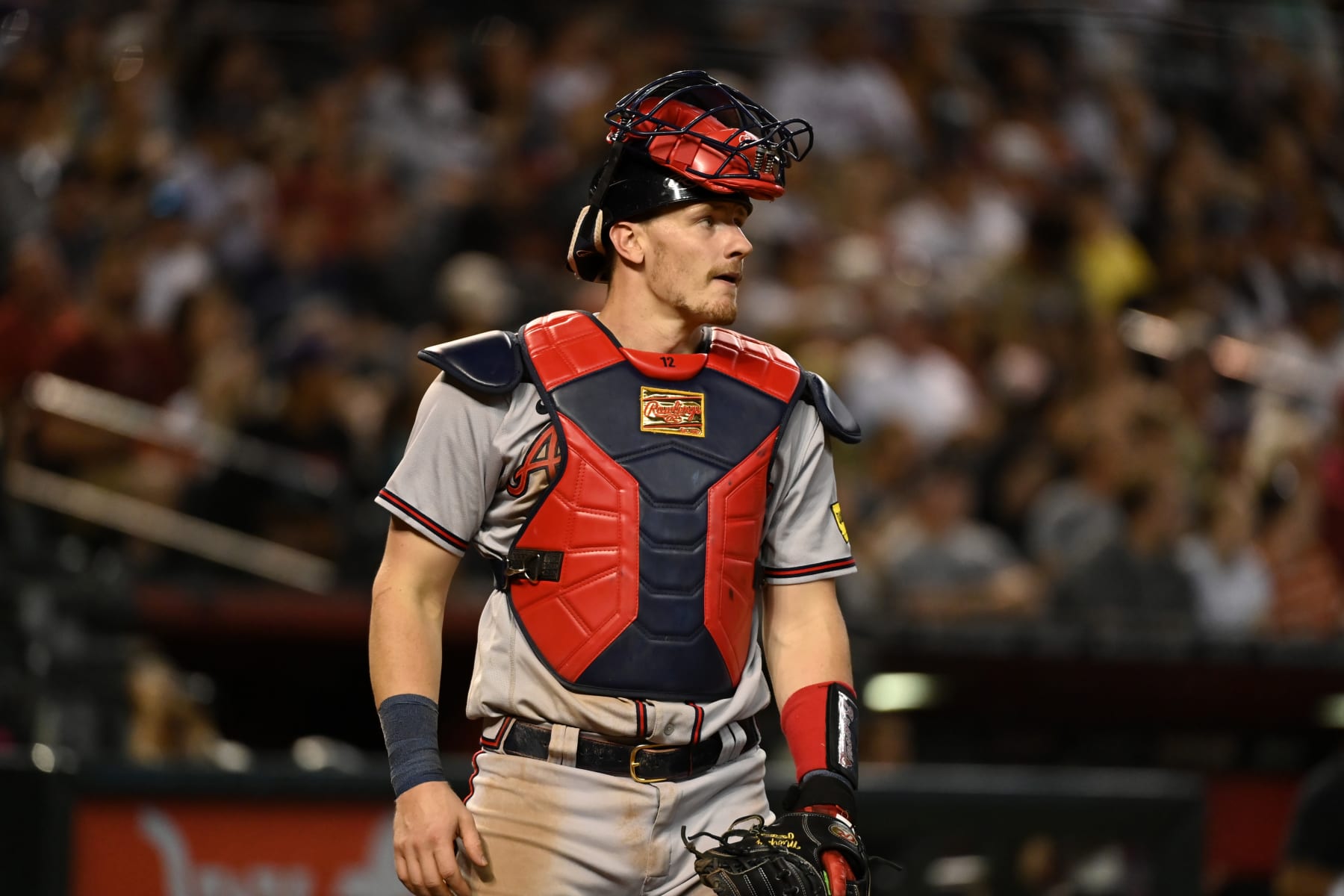 PHOENIX, ARIZONA - JUNE 03: Sean Murphy #12 of the Atlanta Braves looks out from behind home plate against the Arizona Diamondbacks at Chase Field on June 03, 2023 in Phoenix, Arizona. (Photo by Norm Hall/Getty Images)