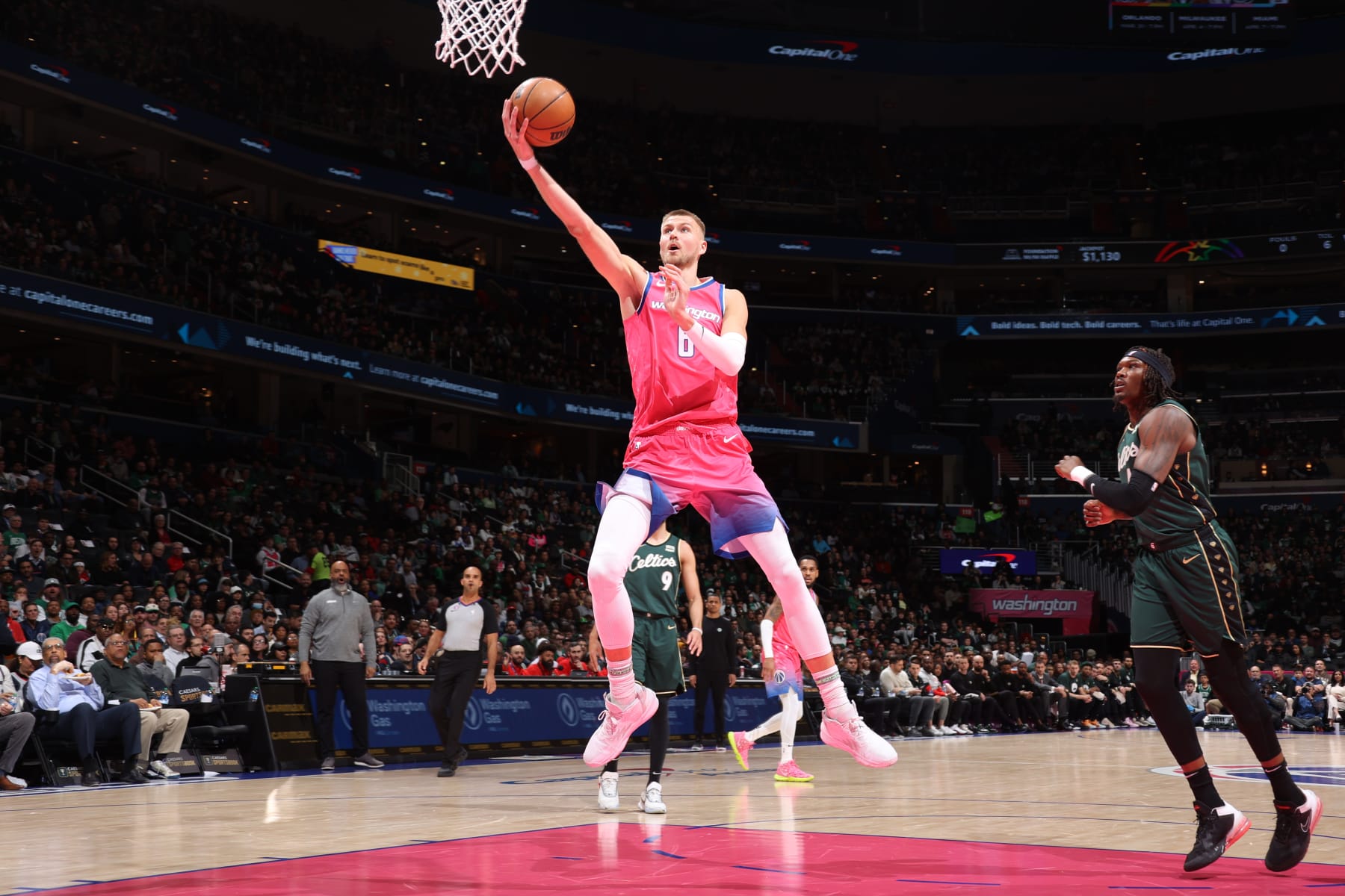 WASHINGTON, DC - MARCH 28: Kristaps Porzingis #6 of the Washington Wizards drives to the basket during the game against the Boston Celtics on March 28, 2023 at Capital One Arena in Washington, DC. NOTE TO USER: User expressly acknowledges and agrees that, by downloading and or using this Photograph, user is consenting to the terms and conditions of the Getty Images License Agreement. Mandatory Copyright Notice: Copyright 2023 NBAE (Photo by Stephen Gosling/NBAE via Getty Images)