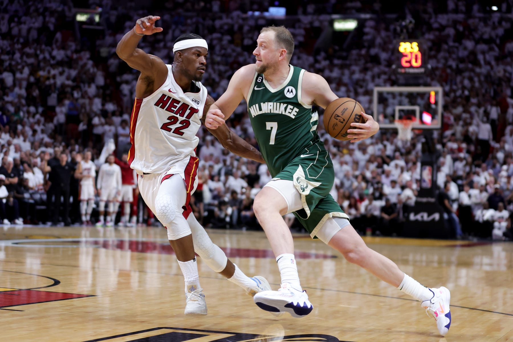 MIAMI, FLORIDA - APRIL 24: Joe Ingles #7 of the Milwaukee Bucks drives against Jimmy Butler #22 of the Miami Heat during the fourth quarter in Game Four of the Eastern Conference First Round Playoffs at Kaseya Center on April 24, 2023 in Miami, Florida. NOTE TO USER: User expressly acknowledges and agrees that, by downloading and or using this photograph, User is consenting to the terms and conditions of the Getty Images License Agreement. (Photo by Megan Briggs/Getty Images)