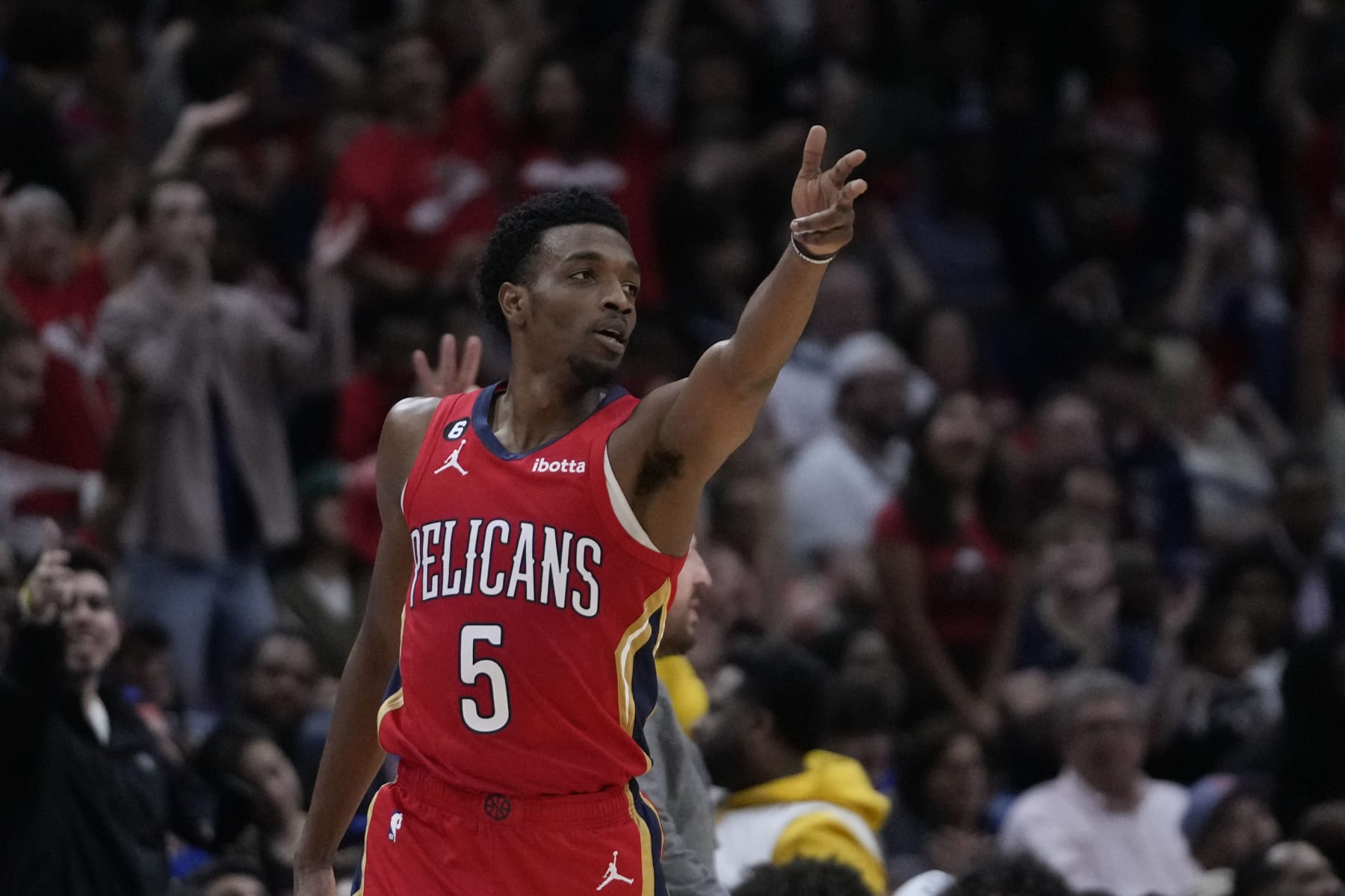 New Orleans Pelicans forward Herbert Jones (5) reacts after making a 3-point basket in the second half of an NBA basketball game against the New York Knicks in New Orleans, Friday, April 7, 2023. The Pelicans won 113-105. (AP Photo/Gerald Herbert)