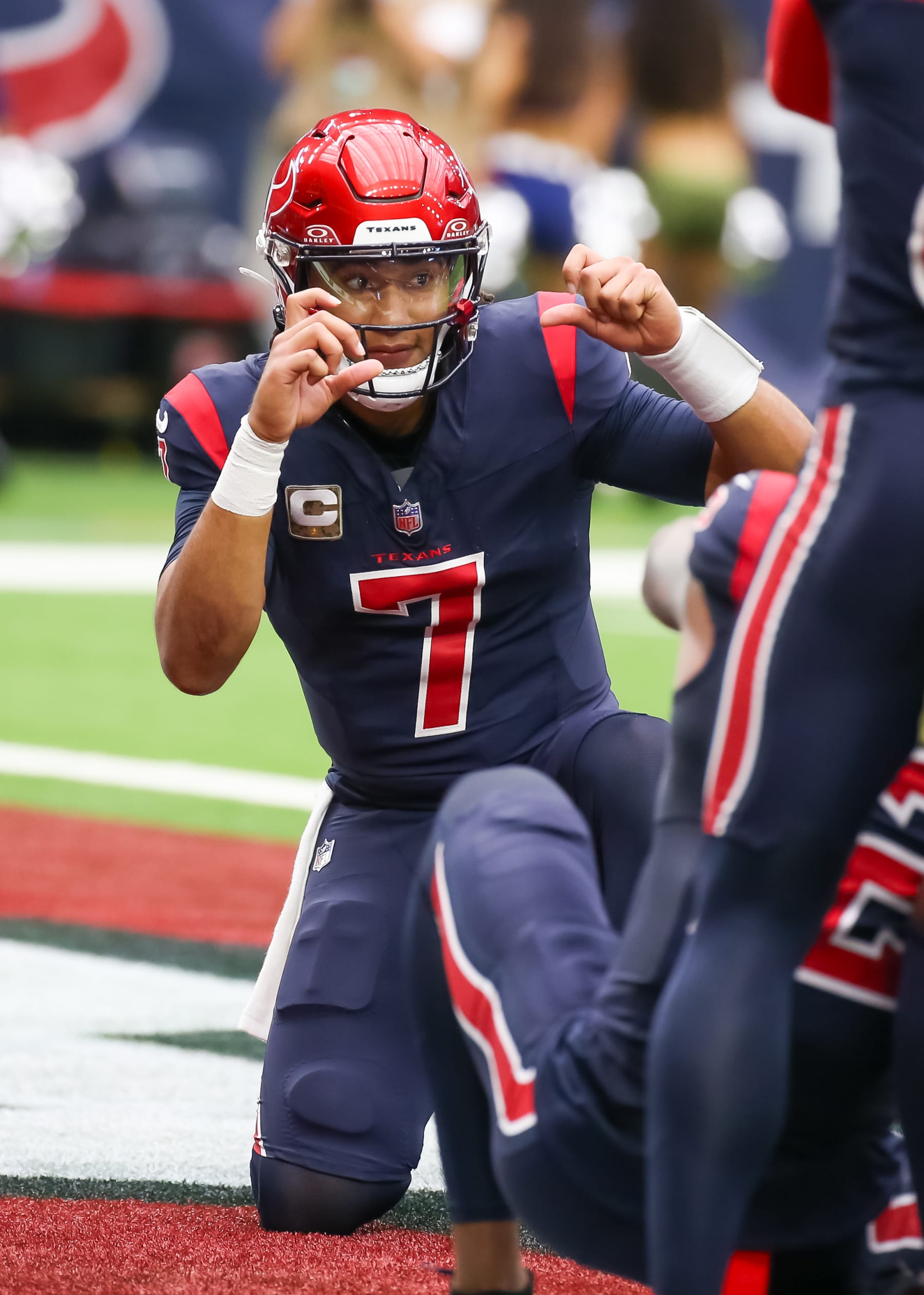HOUSTON, TX - NOVEMBER 19:  Houston Texans quarterback C.J. Stroud (7) celebrates a touchdown made by Houston Texans running back Devin Singletary (26) in the second quarter during the NFL game between the Arizona Cardinals and Houston Texans on November 19, 2023 at NRG Stadium in Houston, Texas.  (Photo by Leslie Plaza Johnson/Icon Sportswire via Getty Images)
