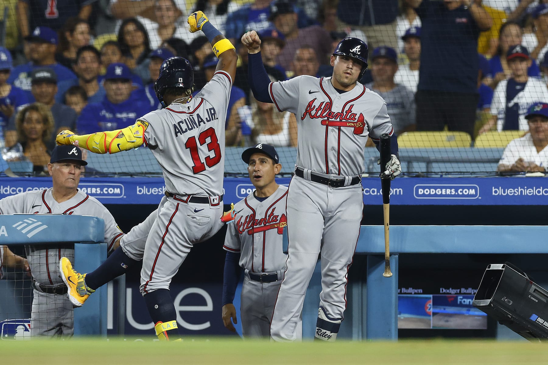 LOS ANGELES, CALIFORNIA - SEPTEMBER 01:  Ronald Acuna Jr. #13 of the Atlanta Braves celebrates a home run with Austin Riley #27 against the Los Angeles Dodgers in the third inning at Dodger Stadium on September 01, 2023 in Los Angeles, California. (Photo by Ronald Martinez/Getty Images)