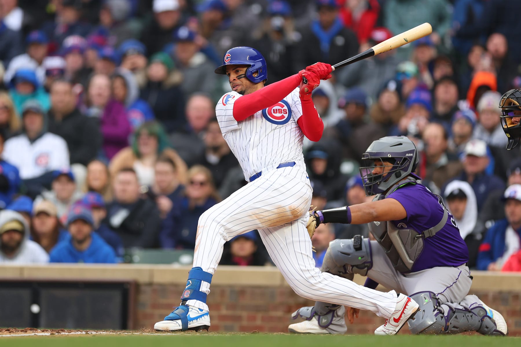 CHICAGO, ILLINOIS - APRIL 01: Christopher Morel #5 of the Chicago Cubs hits a two-RBI single and scores on a fielding and throwing error by Nolan Jones #22 of the Colorado Rockies (not pictured) during the sixth inning at Wrigley Field on April 01, 2024 in Chicago, Illinois. (Photo by Michael Reaves/Getty Images)