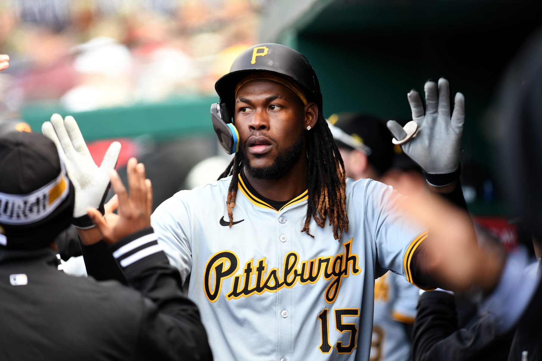 WASHINGTON, DC - APRIL 04: Pittsburgh Pirates shortstop Oneil Cruz (15) is congratulated in the dugout after scoring a run during the Pittsburgh Pirates versus Washington Nationals MLB game at Nationals Park on April 4, 2024 in Washington, D.C.. (Photo by Randy Litzinger/Icon Sportswire via Getty Images)