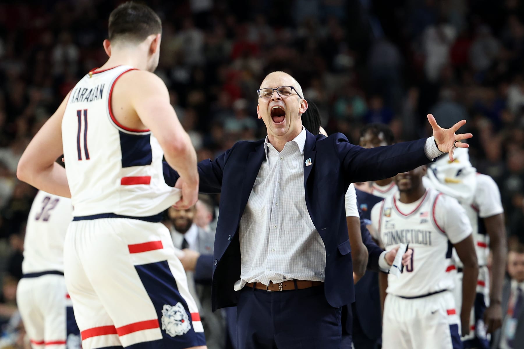GLENDALE, ARIZONA - APRIL 08: Head coach Dan Hurley and Alex Karaban #11 of the Connecticut Huskies celebrate after beating the Purdue Boilermakers 75-60 to win the NCAA Men's Basketball Tournament National Championship game at State Farm Stadium on April 08, 2024 in Glendale, Arizona. (Photo by Jamie Squire/Getty Images)
