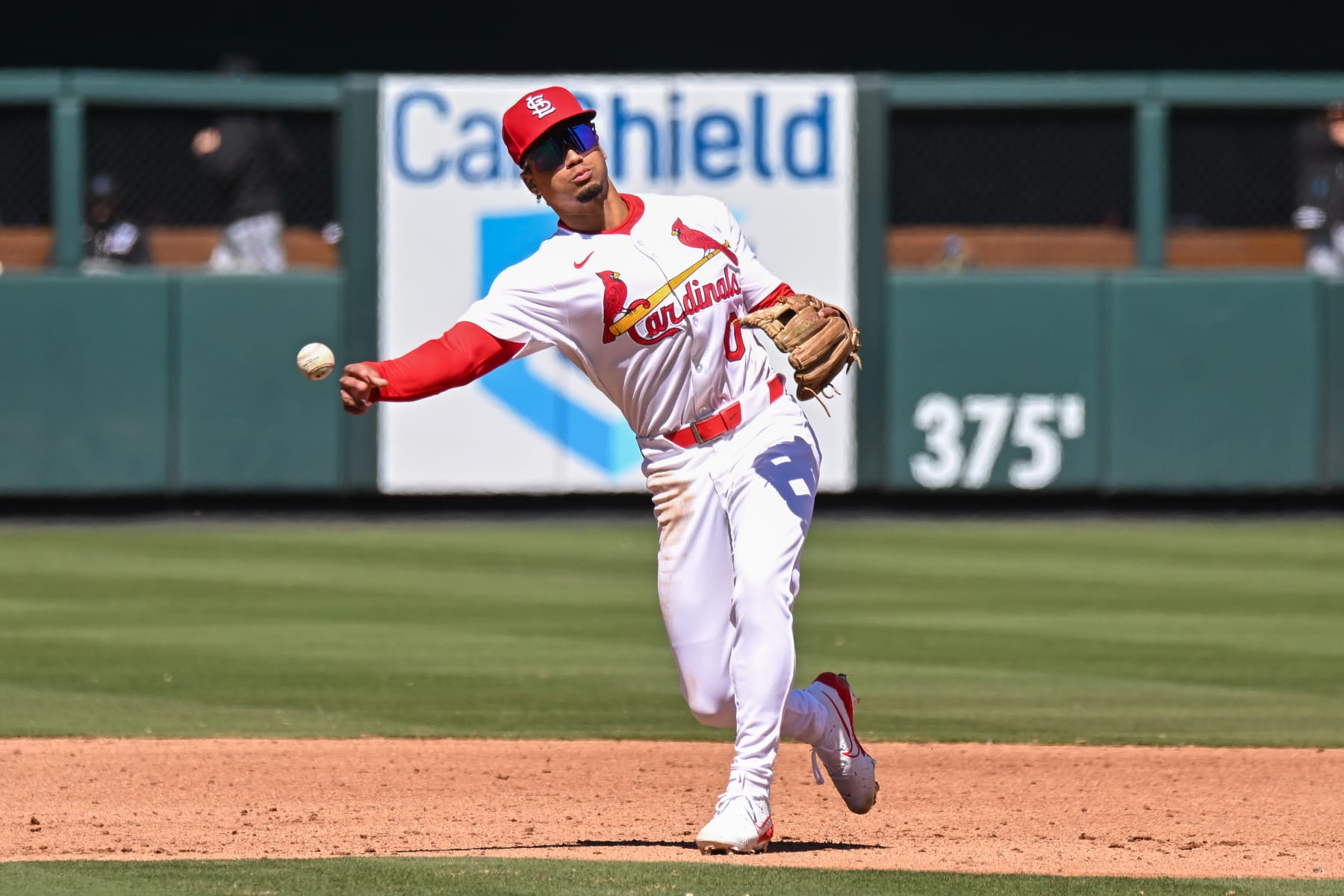 ST. LOUIS, MO - Apr 6: St. Louis Cardinals shortstop Masyn Winn (0) throws over to first base during the 6th inning warm ups during a game between the Miami Marlins and the St. Louis Cardinals on Saturday April 6, 2024, at Busch Stadium in St. Louis MO (Photo by Rick Ulreich/Icon Sportswire via Getty Images)