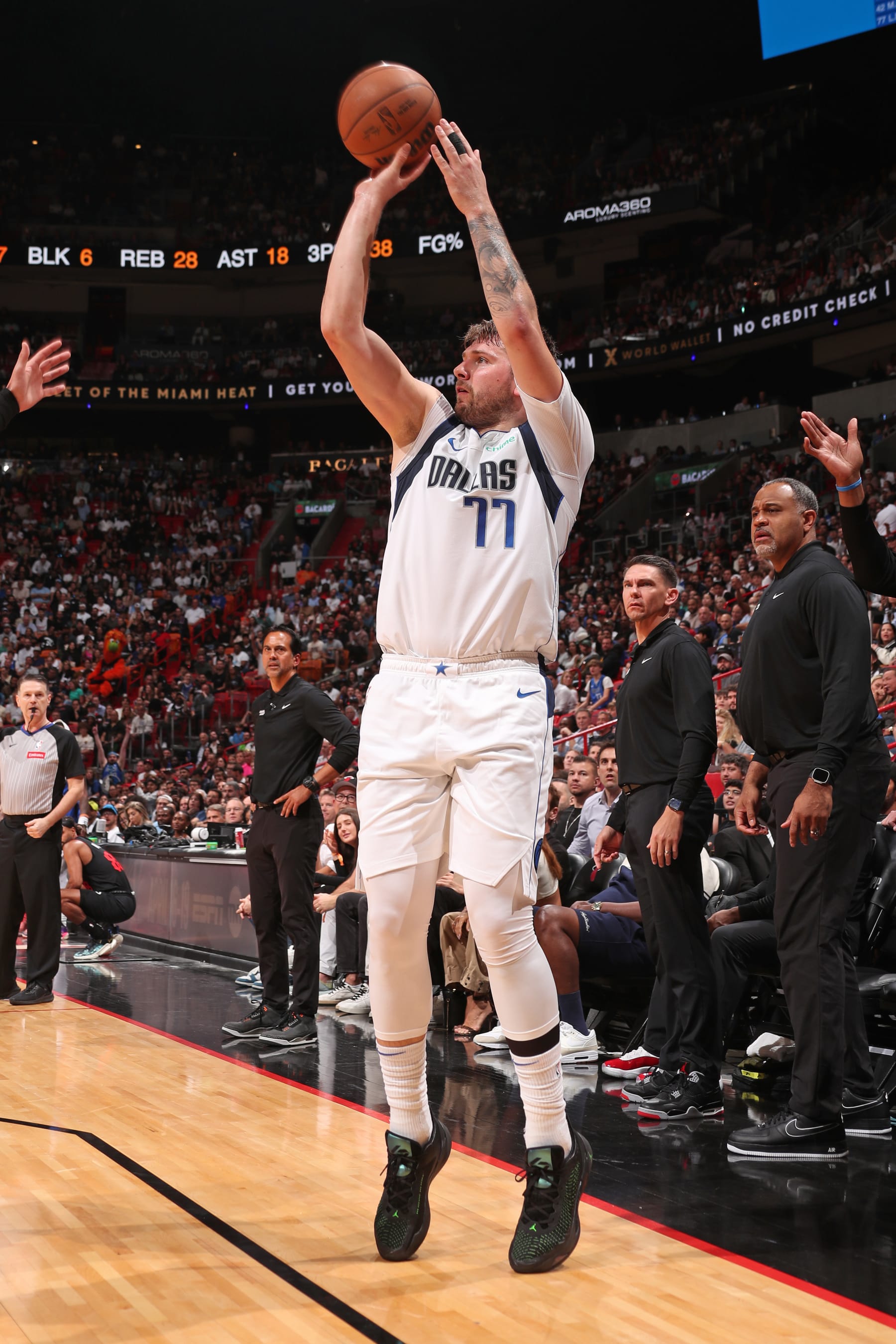 MIAMI, FL - APRIL 10:  Luka Doncic #77 of the Dallas Mavericks shoots a three point basket during the game against the Miami Heat on April 10, 2024 at Kaseya Center in Miami, Florida. NOTE TO USER: User expressly acknowledges and agrees that, by downloading and or using this Photograph, user is consenting to the terms and conditions of the Getty Images License Agreement. Mandatory Copyright Notice: Copyright 2024 NBAE (Photo by Issac Baldizon/NBAE via Getty Images)