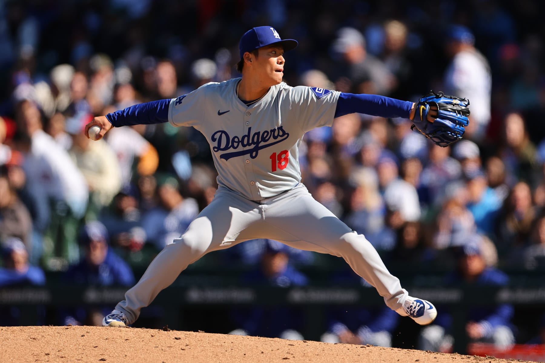 CHICAGO, ILLINOIS - APRIL 06: Yoshinobu Yamamoto #18 of the Los Angeles Dodgers delivers a pitch against the Chicago Cubs during the first inning at Wrigley Field on April 06, 2024 in Chicago, Illinois. (Photo by Michael Reaves/Getty Images)
