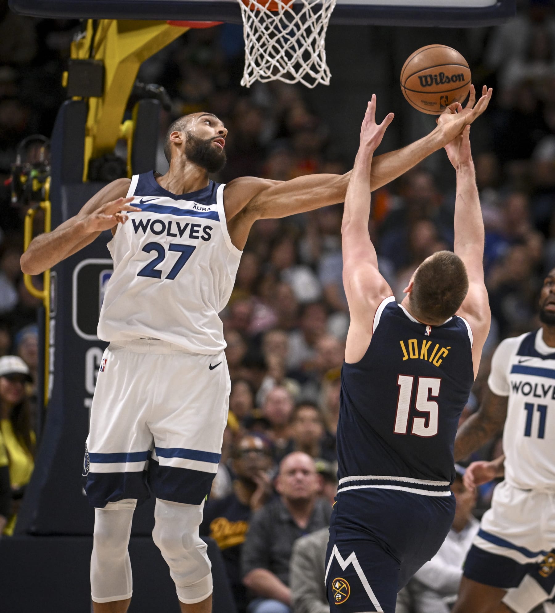 DENVER, CO - APRIL 10: Rudy Gobert (27) of the Minnesota Timberwolves grabs the ball after blocking a shot by Nikola Jokic (15) of the Denver Nuggets during the second quarter at Ball Arena in Denver on Wednesday, April 10, 2024. (Photo by AAron Ontiveroz/The Denver Post)