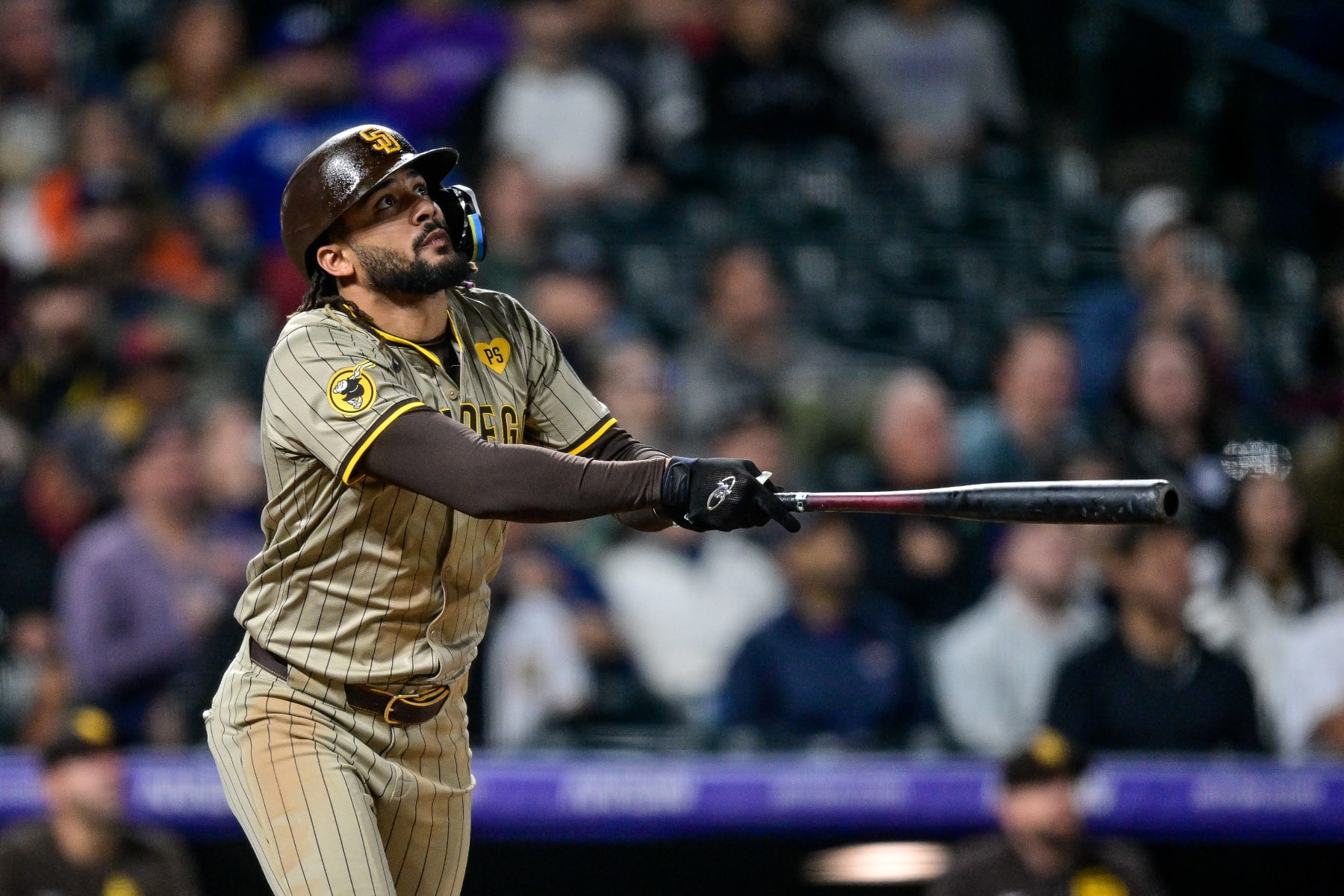 DENVER, COLORADO - APRIL 22: Fernando Tatis Jr. #23 of the San Diego Padres hits a triple in the seventh inning against the Colorado Rockies at Coors Field on April 22, 2024 in Denver, Colorado. (Photo by Dustin Bradford/Getty Images)