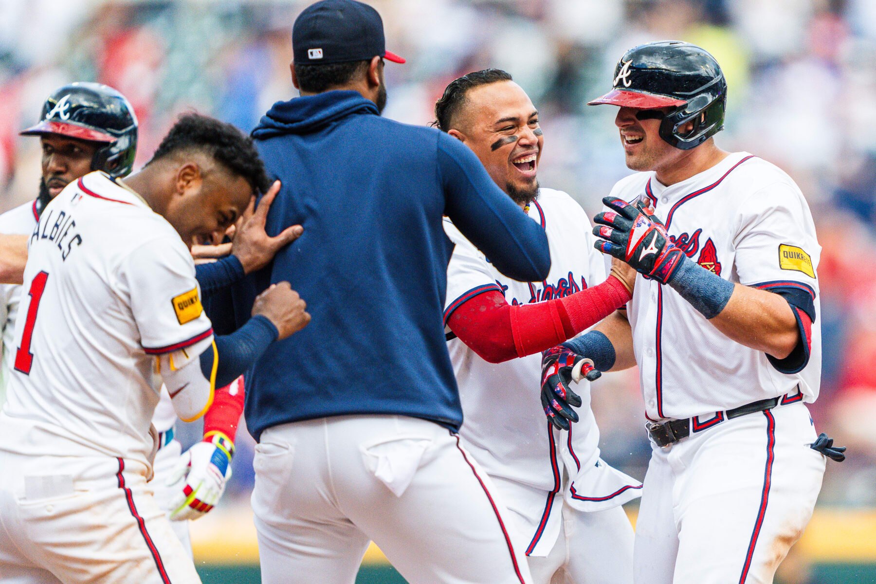 ATLANTA, GA - APRIL 28: Marcell Ozuna #20, Ozzie Albies #1, Orlando Arcia #11, Reynaldo Lopez #40 and Austin Riley #27 of the Atlanta Braves celebrate after Riley hit a walk off single in the tenth inning against the Cleveland Guardians at Truist Park on April 28, 2024 in Atlanta, Georgia. (Photo by Matthew Grimes Jr./Atlanta Braves/Getty Images)