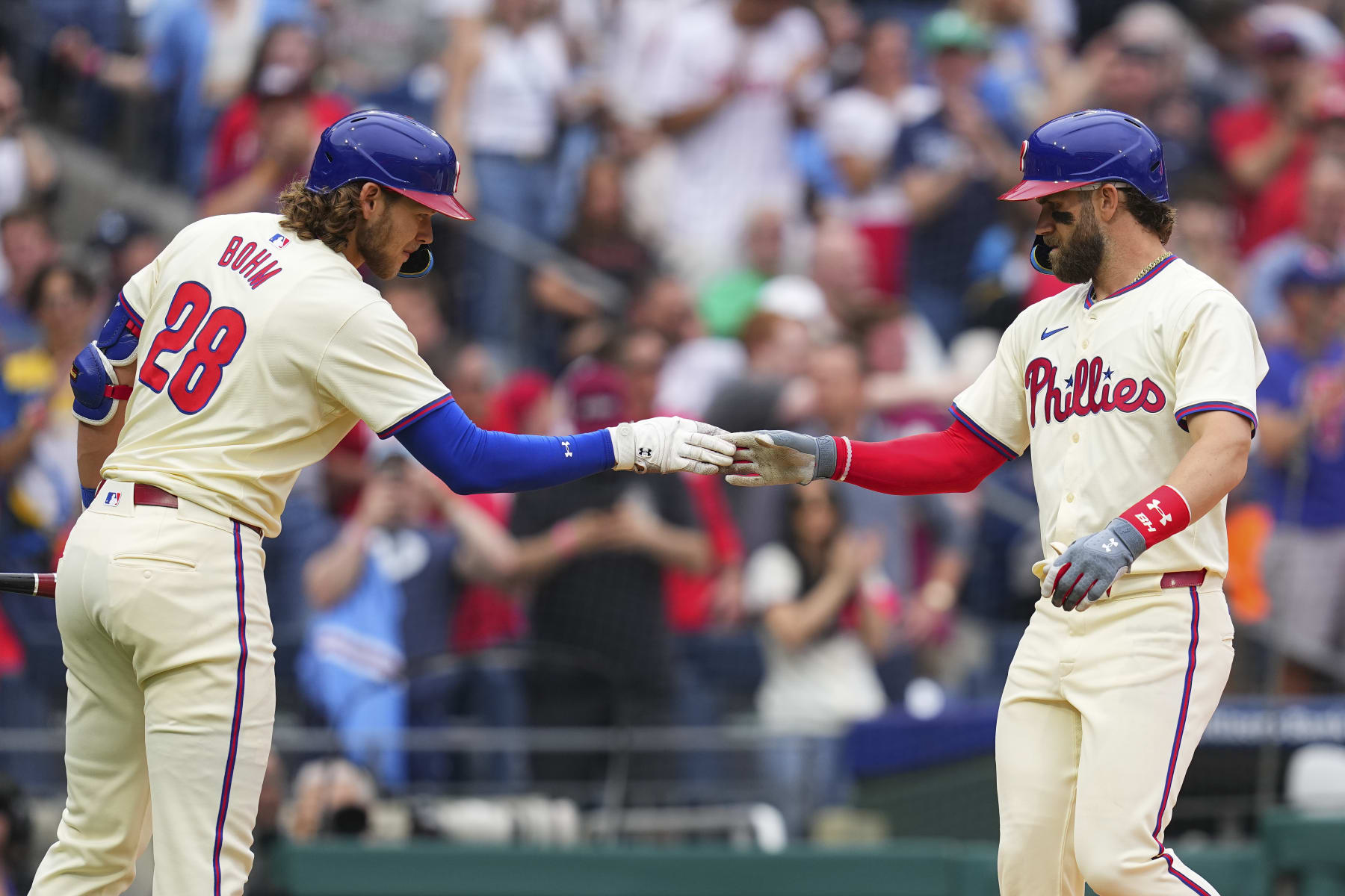 PHILADELPHIA, PENNSYLVANIA - MAY 6: Bryce Harper #3 of the Philadelphia Phillies celebrates with Alec Bohm #28 after hitting a three run home run against the San Francisco Giants in the bottom of the fifth inning at Citizens Bank Park on May 6, 2024 in Philadelphia, Pennsylvania. (Photo by Mitchell Leff/Getty Images)