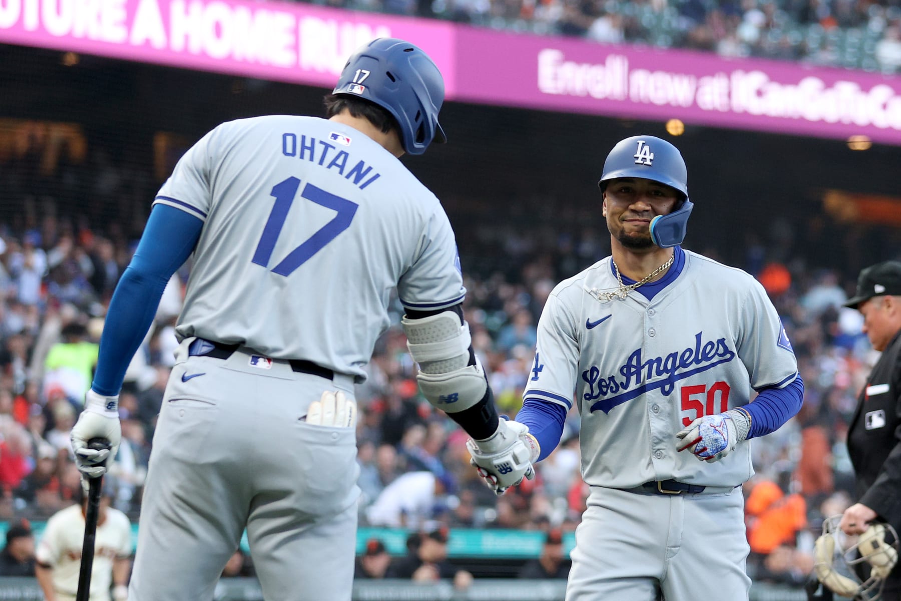 SAN FRANCISCO, CALIFORNIA - MAY 13: Mookie Betts #50 of the Los Angeles Dodgers is congratulated by Shohei Ohtani #17 after he hit a home run against the San Francisco Giants in the first inning at Oracle Park on May 13, 2024 in San Francisco, California. (Photo by Ezra Shaw/Getty Images)
