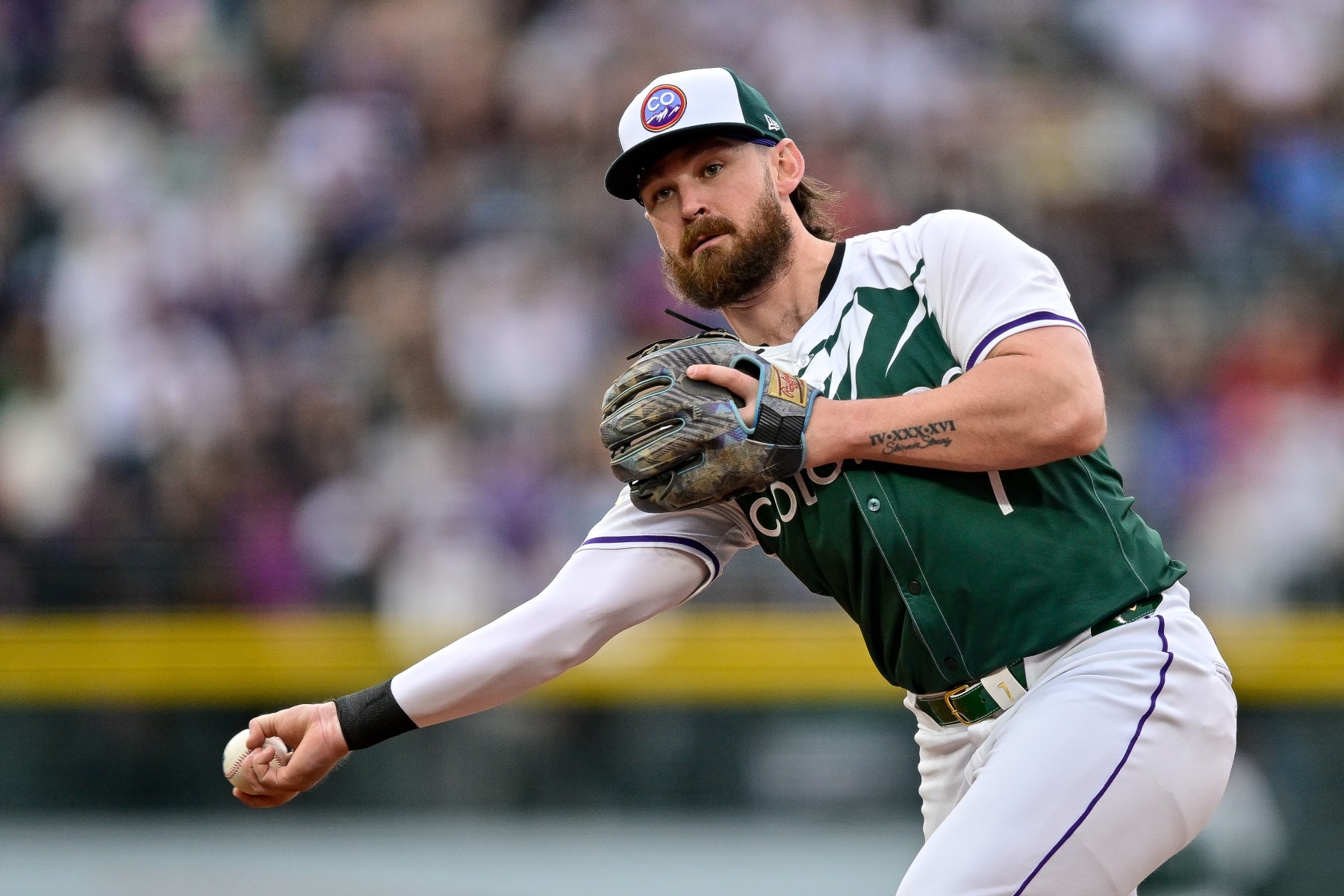 DENVER, COLORADO - MAY 11: Brendan Rodgers #7 of the Colorado Rockies throws to first base after fielding a ground ball in the third ining against the Texas Rangers at Coors Field on May 11, 2024 in Denver, Colorado. (Photo by Dustin Bradford/Getty Images) DENVER, COLORADO - MAY 11: Brendan Rodgers #7 of the Colorado Rockies throws to first base after fielding a ground ball in the third ining against the Texas Rangers at Coors Field on May 11, 2024 in Denver, Colorado. (Photo by Dustin Bradford/Getty Images)