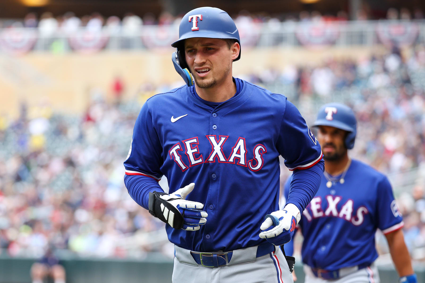MINNEAPOLIS, MINNESOTA - MAY 26: Corey Seager #5 of the Texas Rangers walks back to the dugout after his two-run home run against the Minnesota Twins during the third inning at Target Field on May 26, 2024 in Minneapolis, Minnesota. (Photo by Matt Krohn/Getty Images)