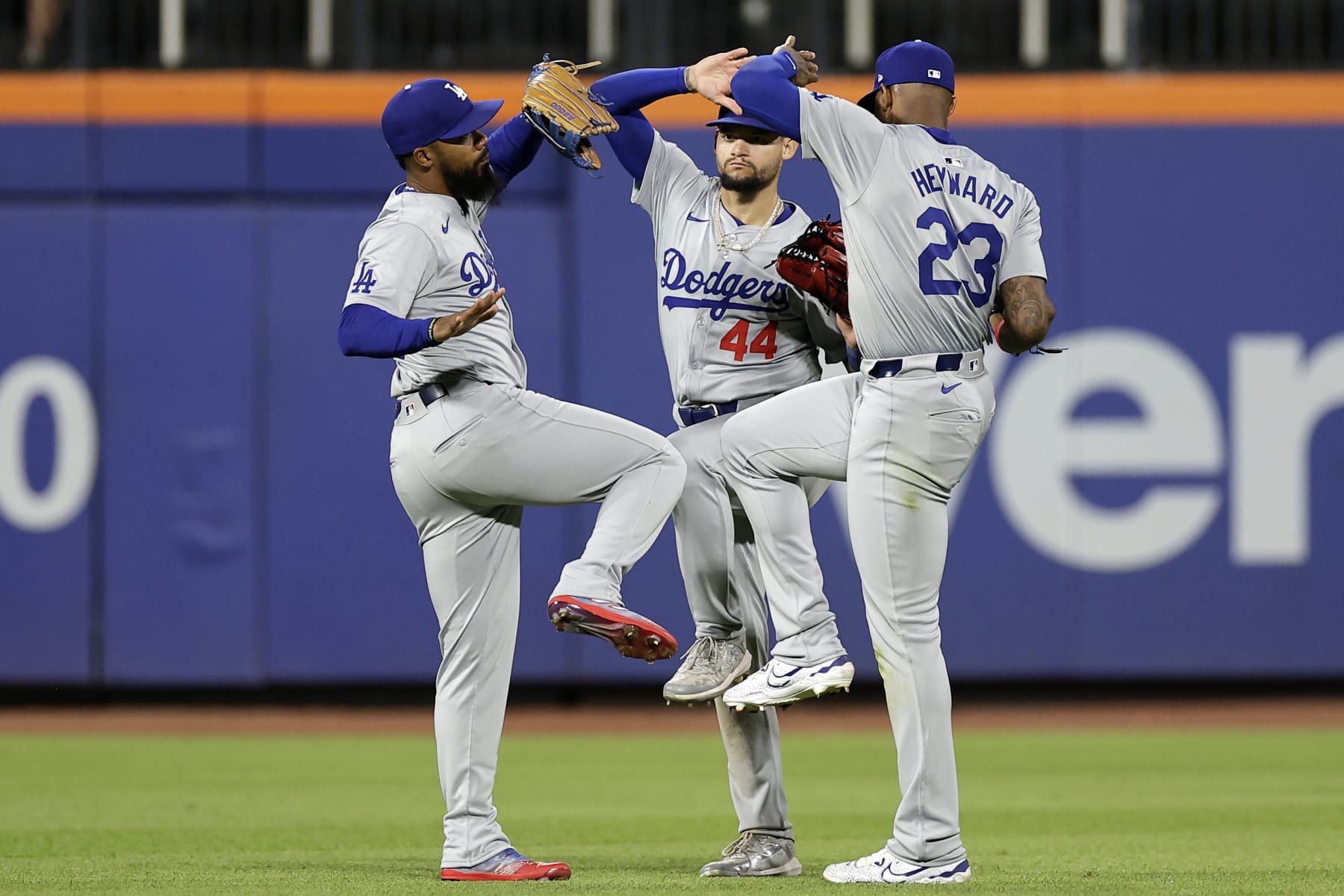 NEW YORK, NY - MAY 28: Andy Pages #44 of the Los Angeles Dodgers, Jason Heyward #23 of the Los Angeles Dodgers and Teoscar Hernández #37 of the Los Angeles Dodgers celebrate after defeating the New York Mets in game two of a doubleheader at Citi Field on May 28, 2024 in New York City. (Photo by Adam Hunger/Getty Images)